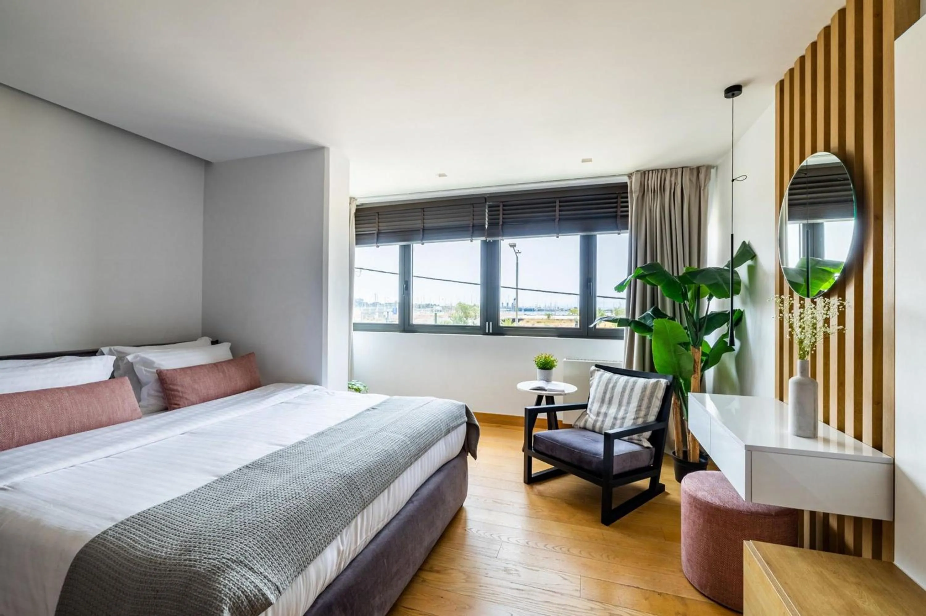 Bed in Earth Boutique Apartments next to Stavros Niarchos