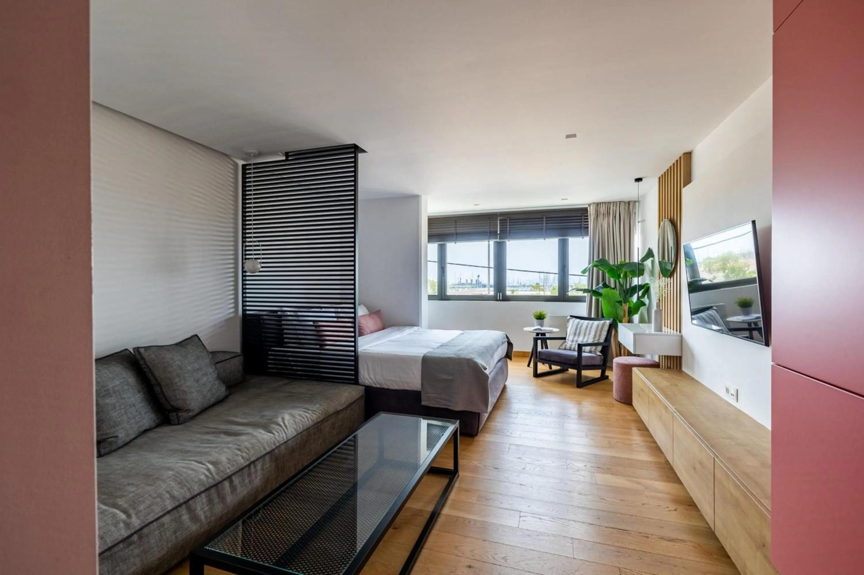 Bed in Earth Boutique Apartments next to Stavros Niarchos