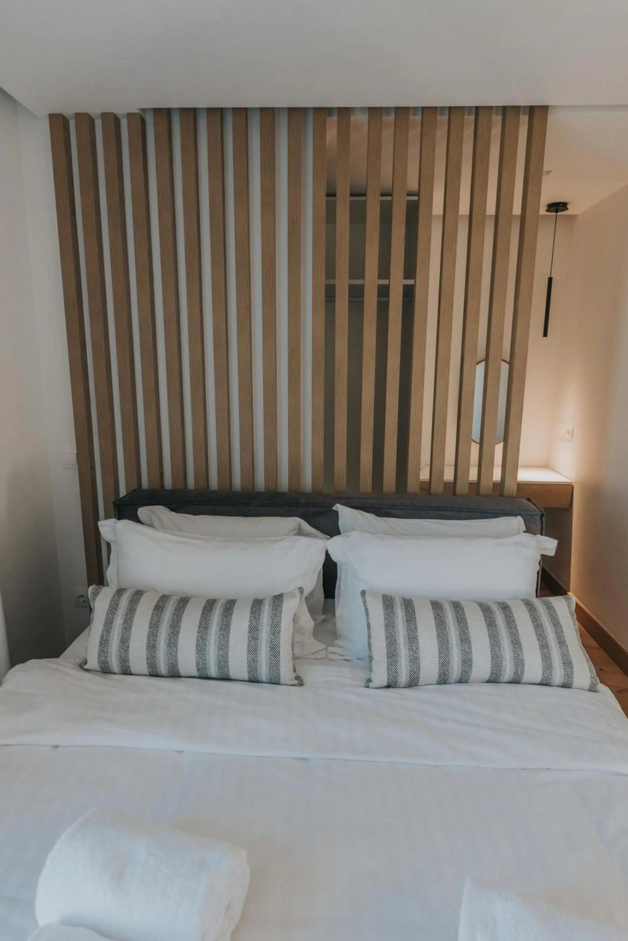 Bed in Earth Boutique Apartments next to Stavros Niarchos