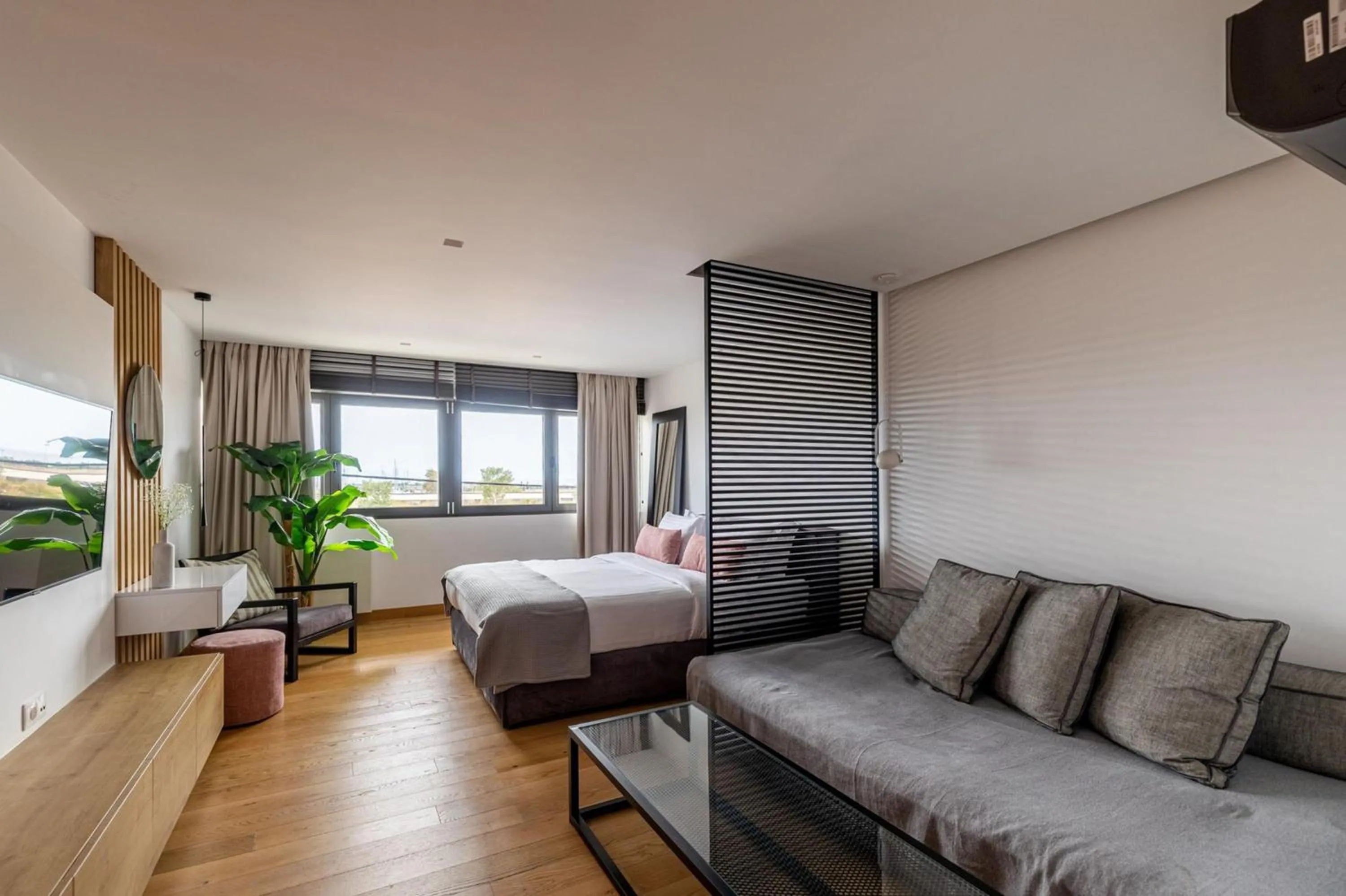 Bed in Earth Boutique Apartments next to Stavros Niarchos