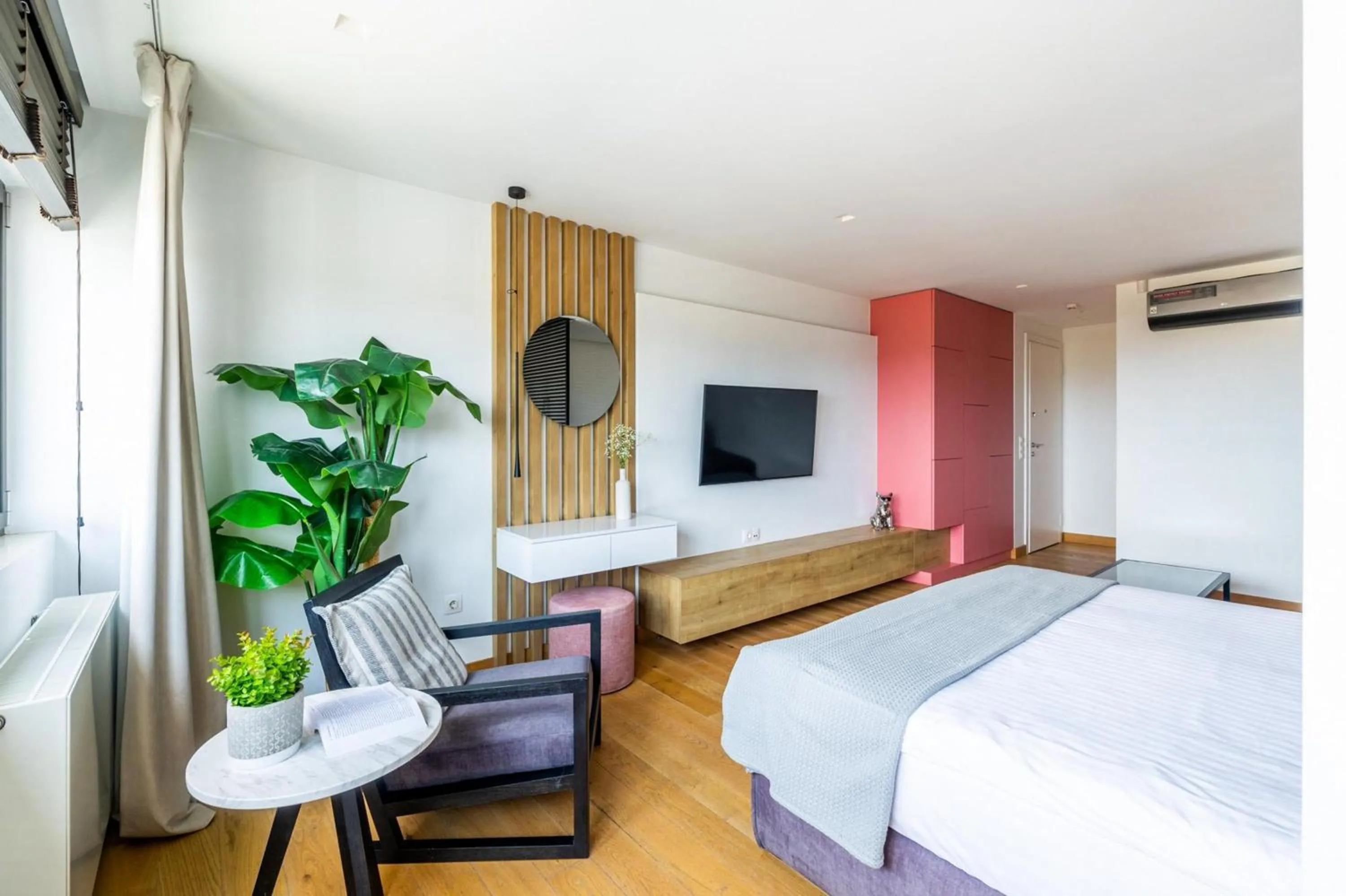 Bed in Earth Boutique Apartments next to Stavros Niarchos