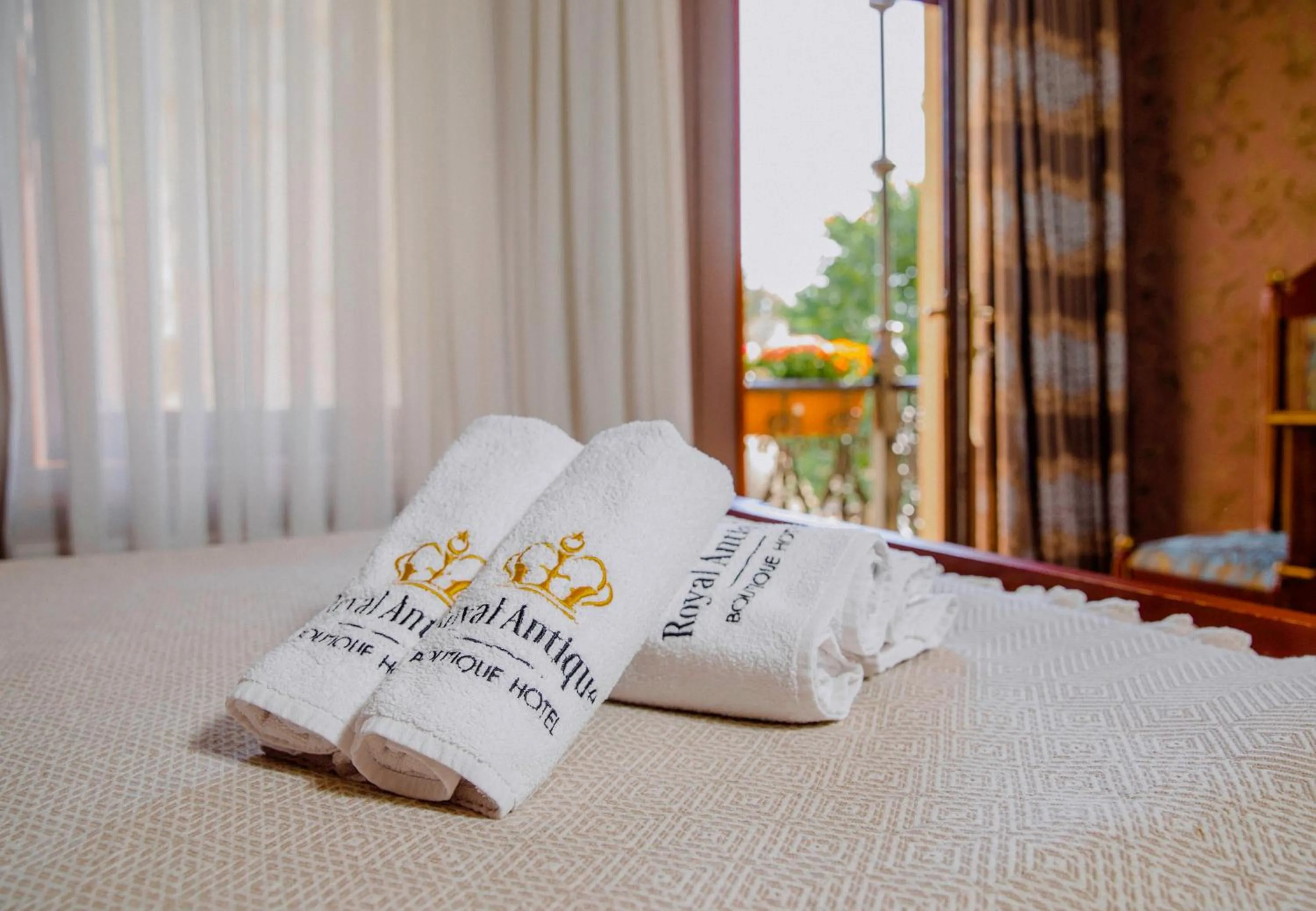 Bed in Royal Antique Boutique Hotel