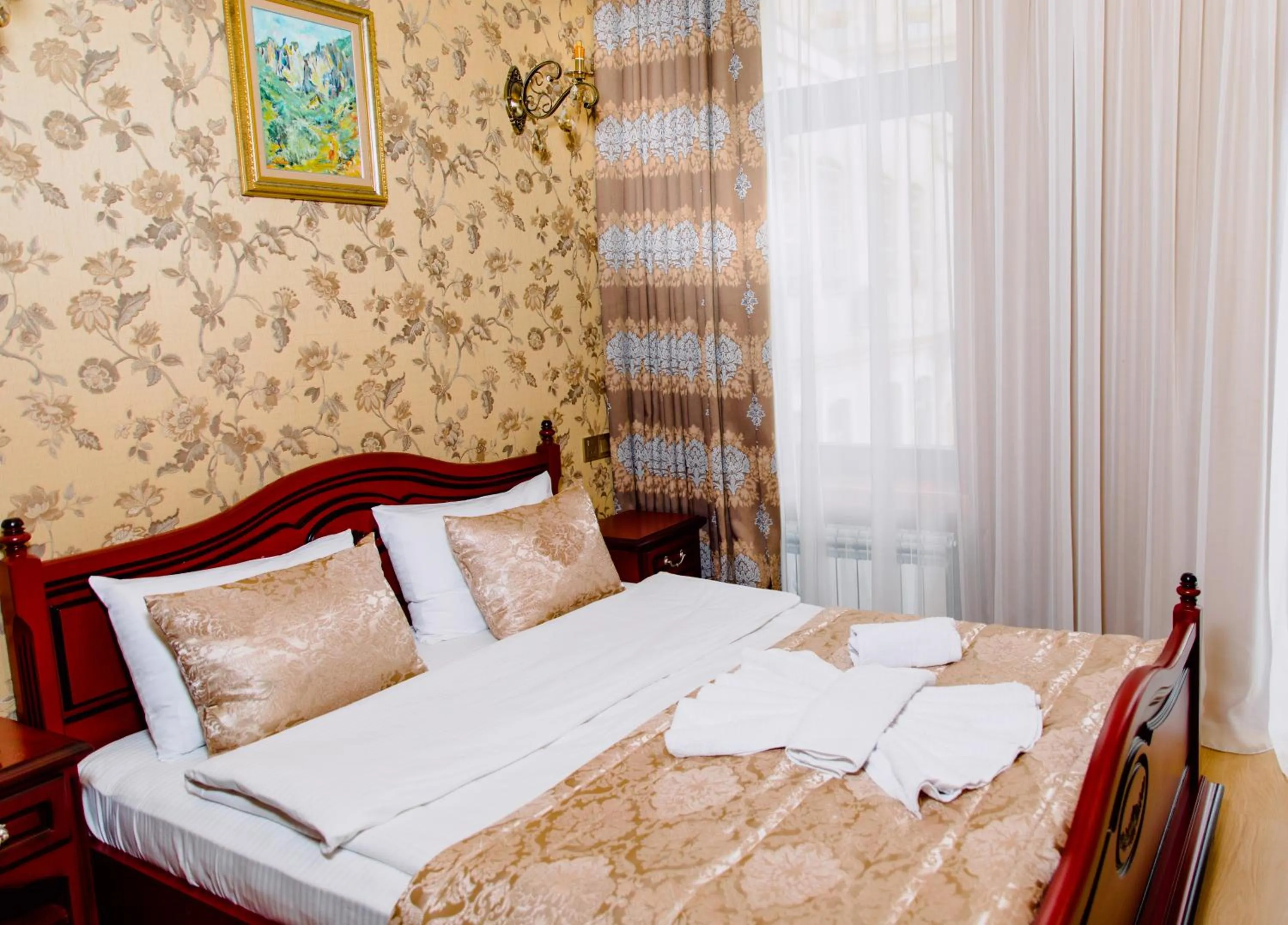 Bed in Royal Antique Boutique Hotel