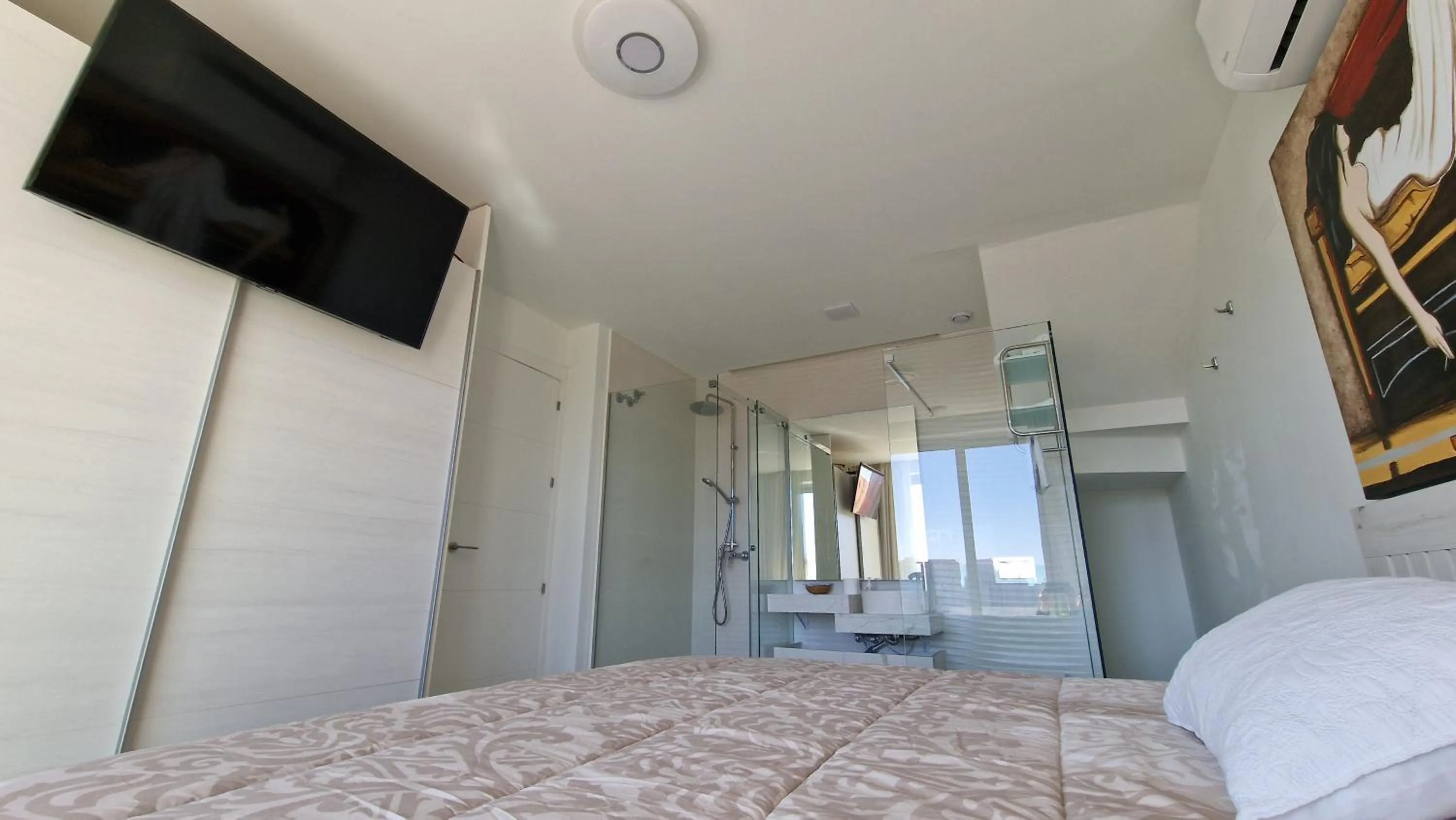 Bed in APARTAMENTOS OASIS DE LA CALA