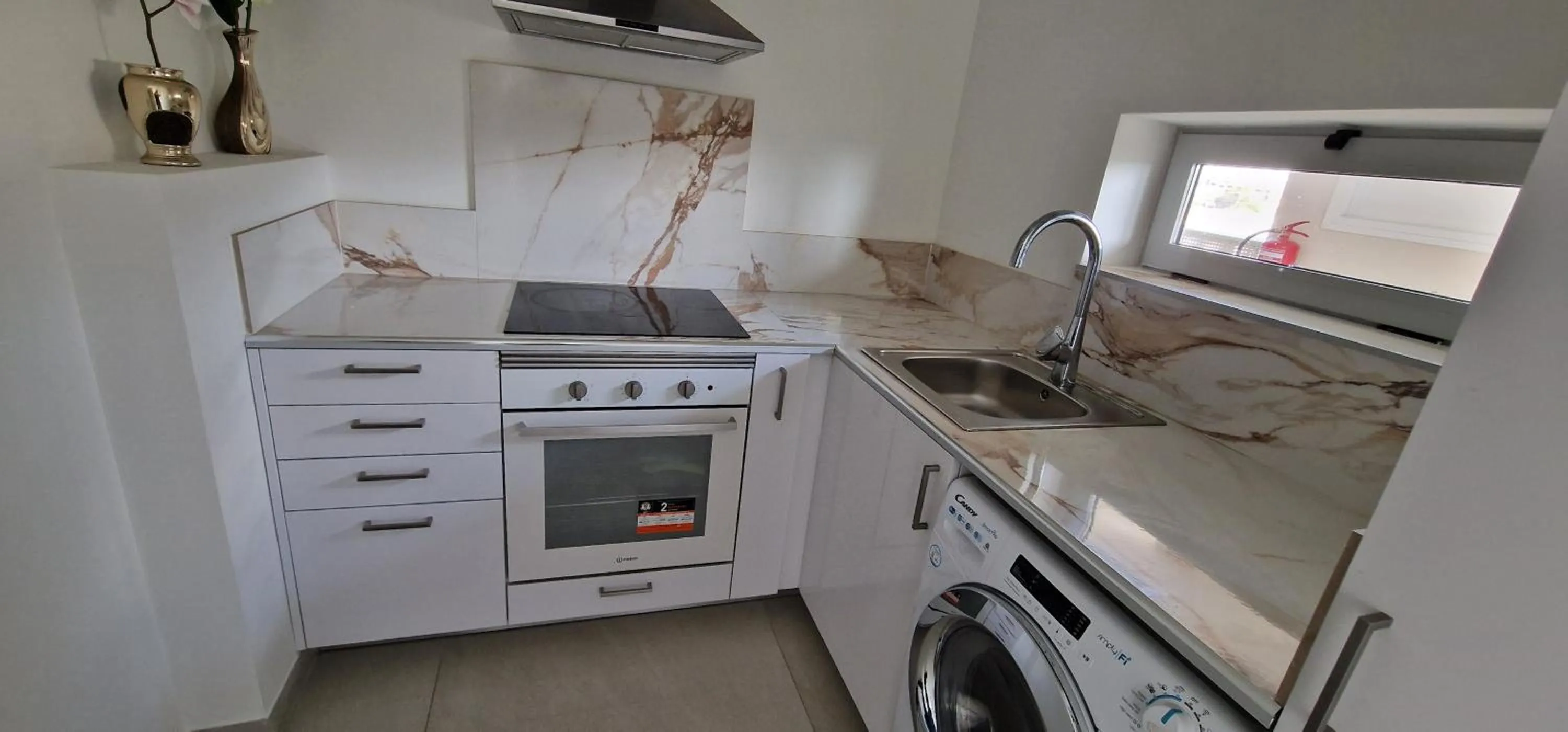 Kitchen or kitchenette in APARTAMENTOS OASIS DE LA CALA