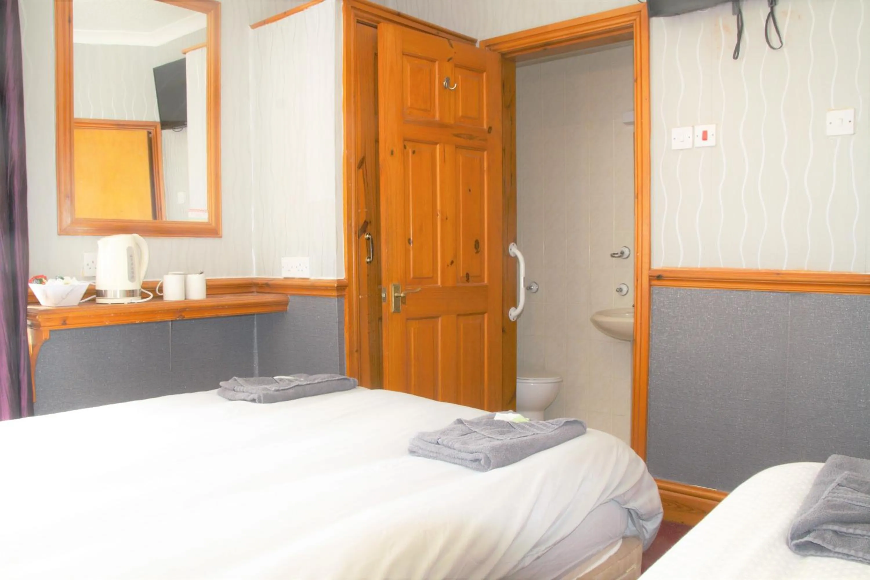 Bed in Pine Lodge Hotel