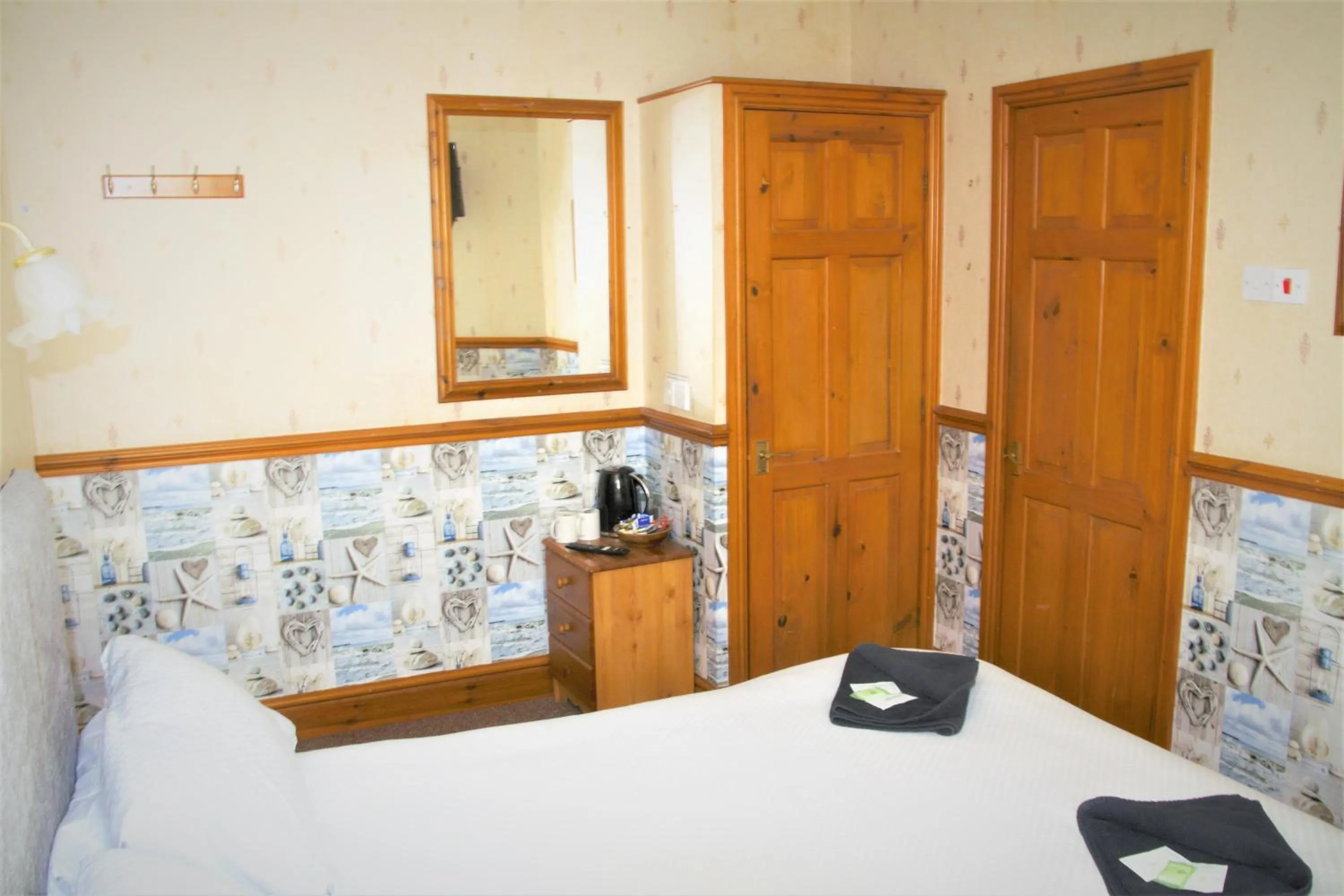 Bed in Pine Lodge Hotel