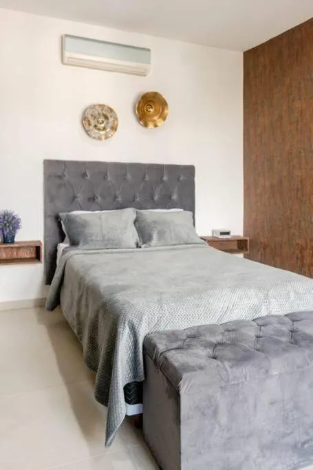 Bed in Hermoso Penthouse Rooftop con alberca