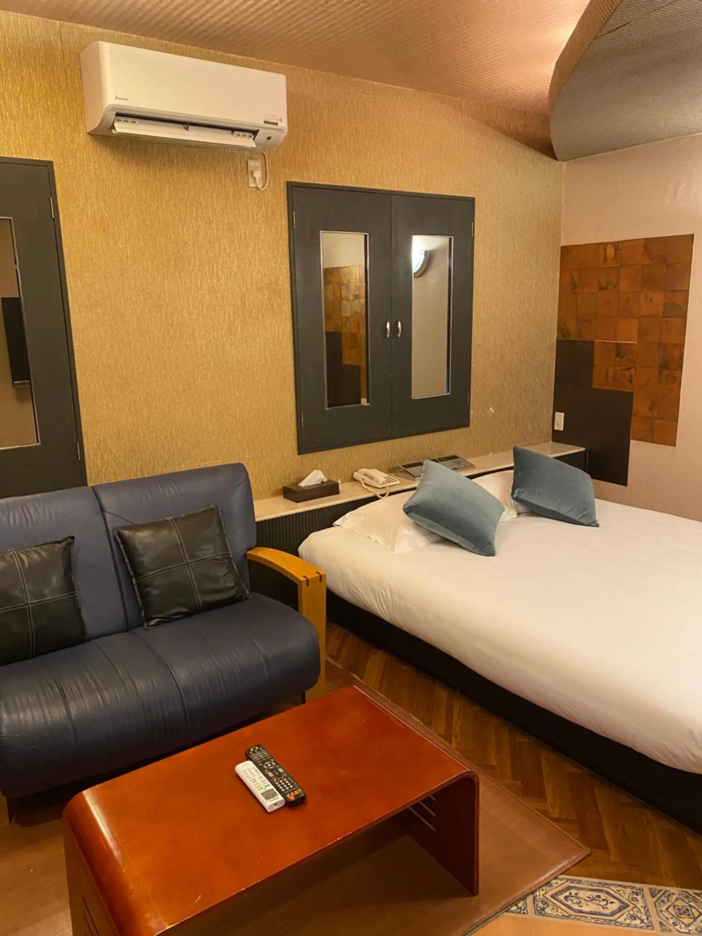 Bed in Hotel Takao Asile