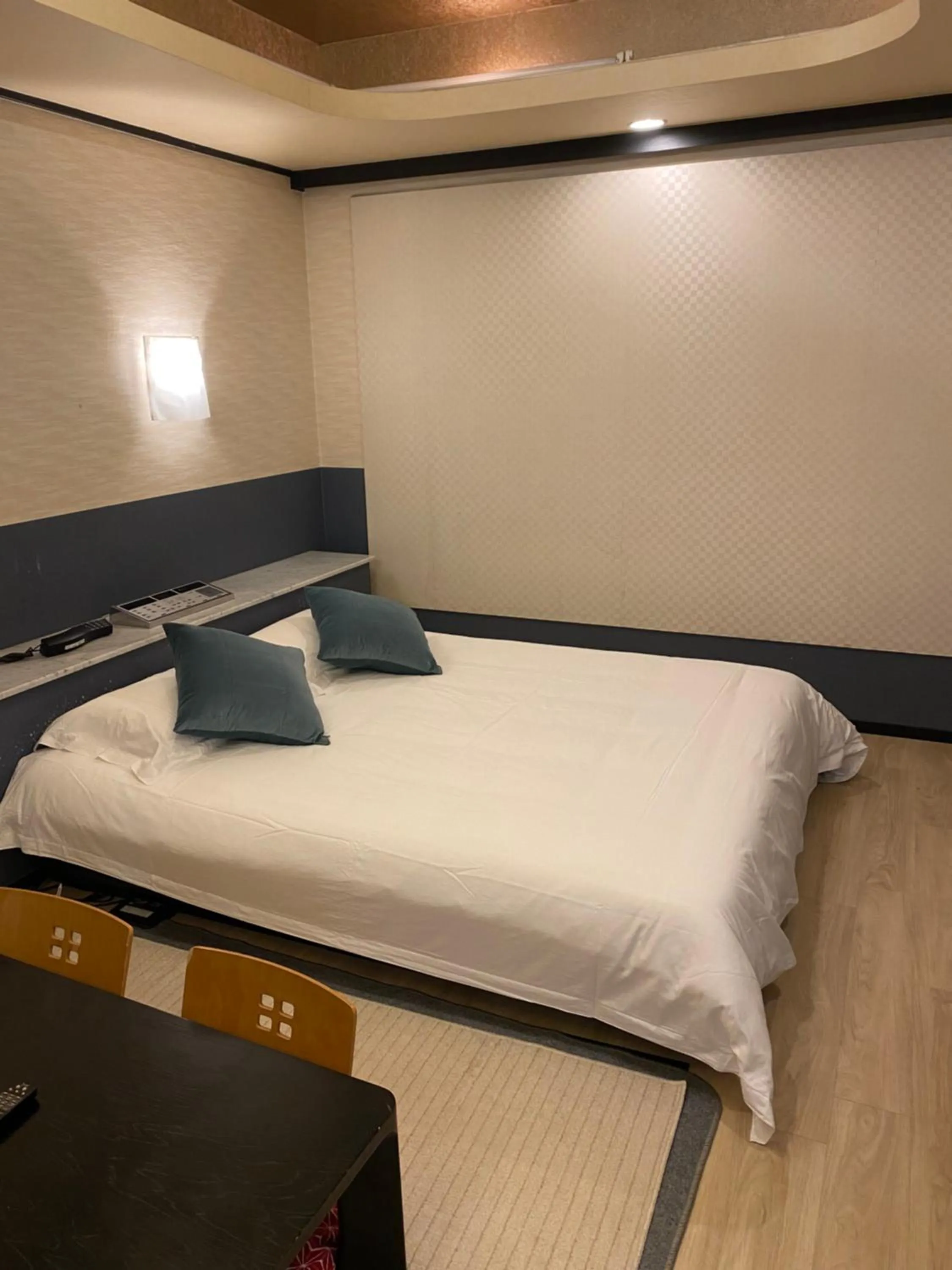 Bed in Hotel Takao Asile