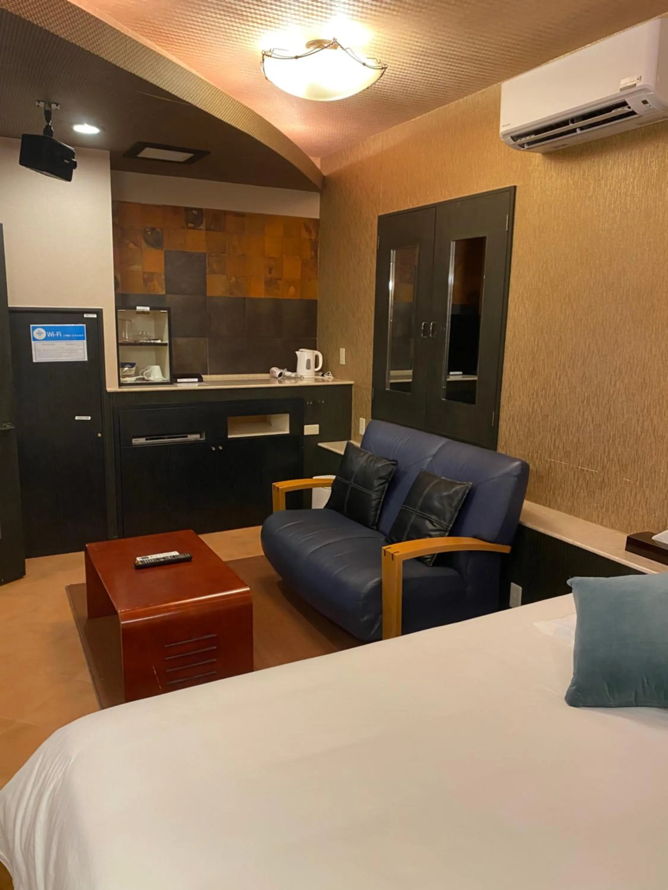 Bed in Hotel Takao Asile