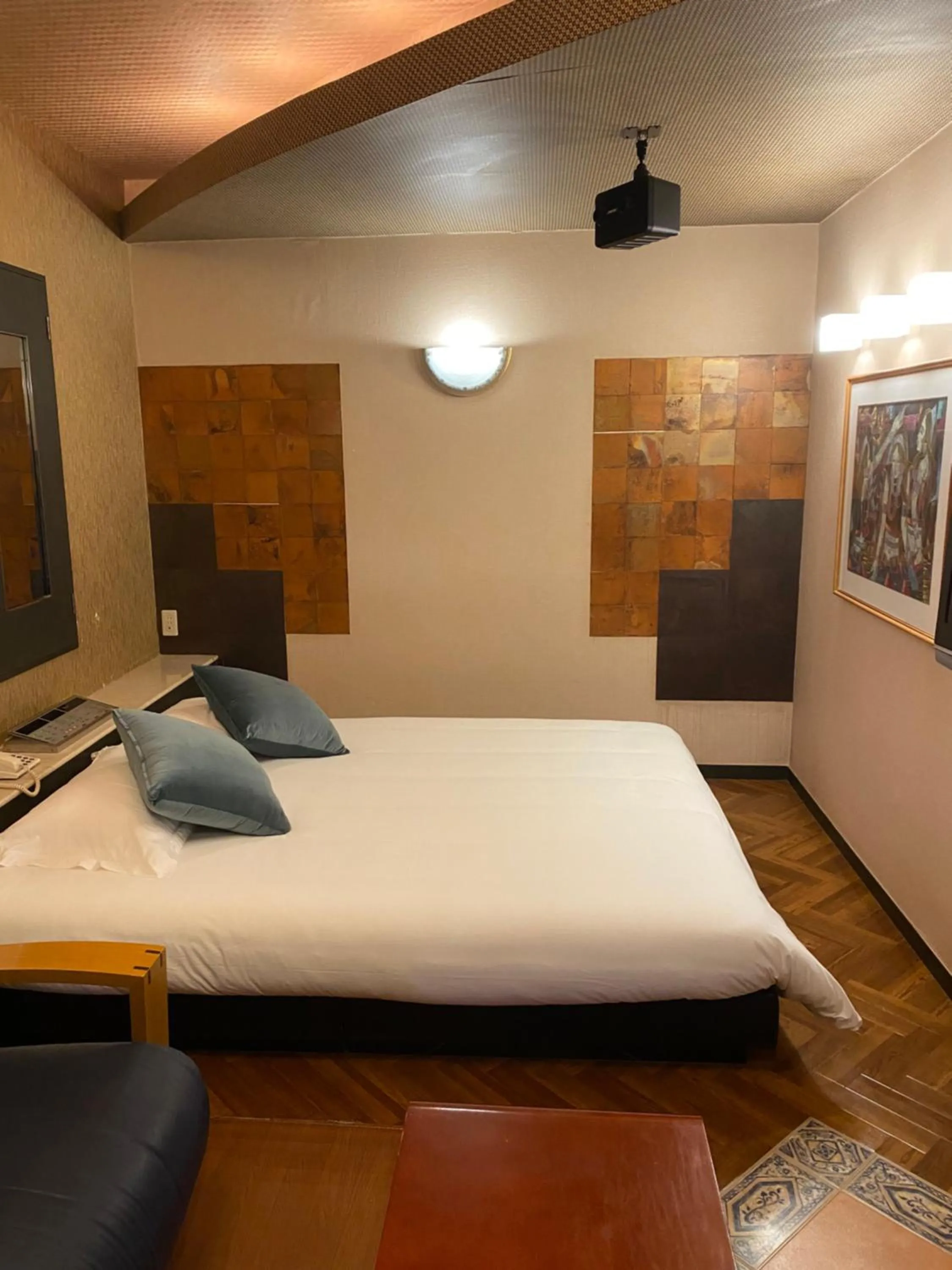 Bed in Hotel Takao Asile