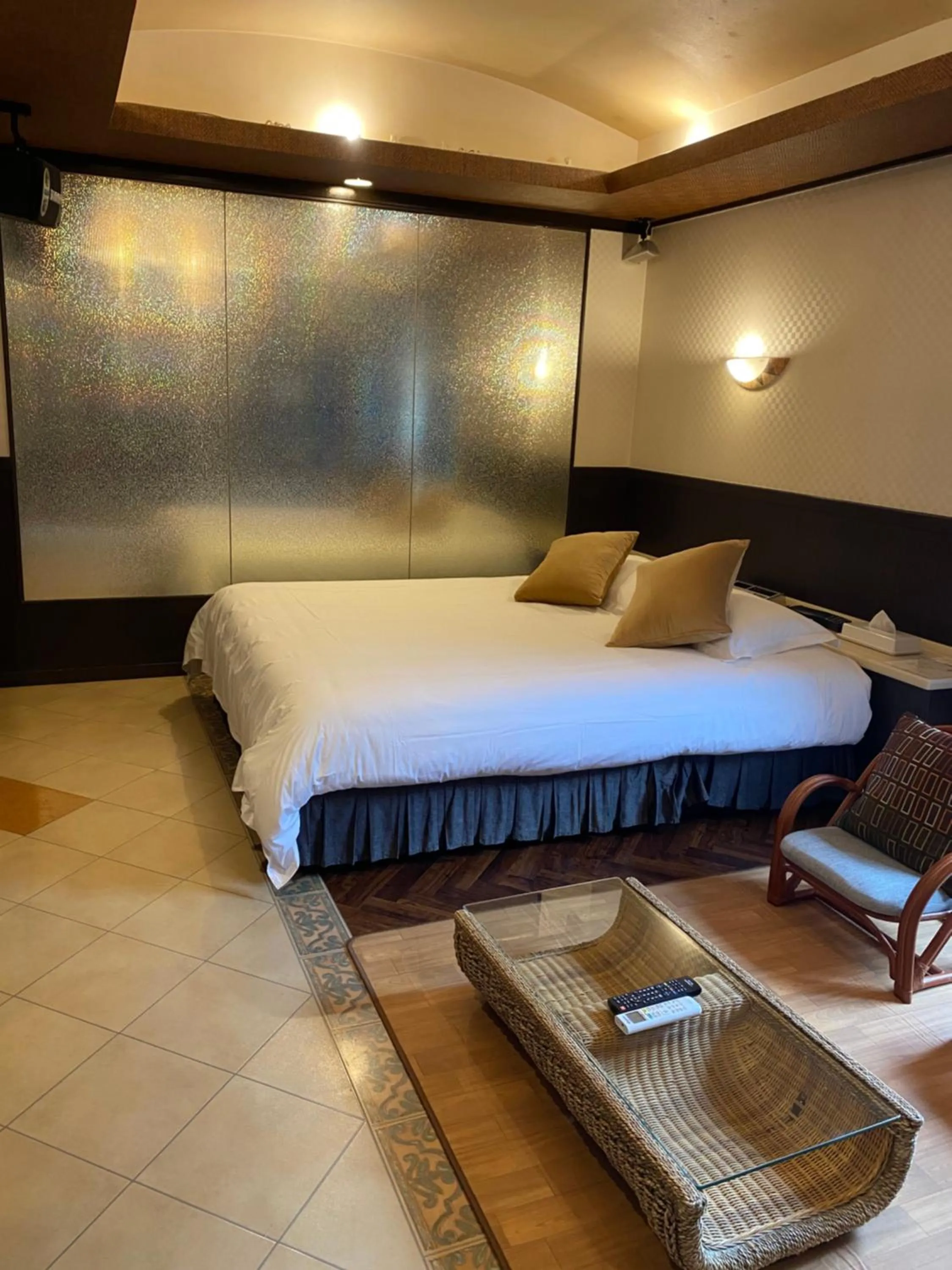 Bed in Hotel Takao Asile