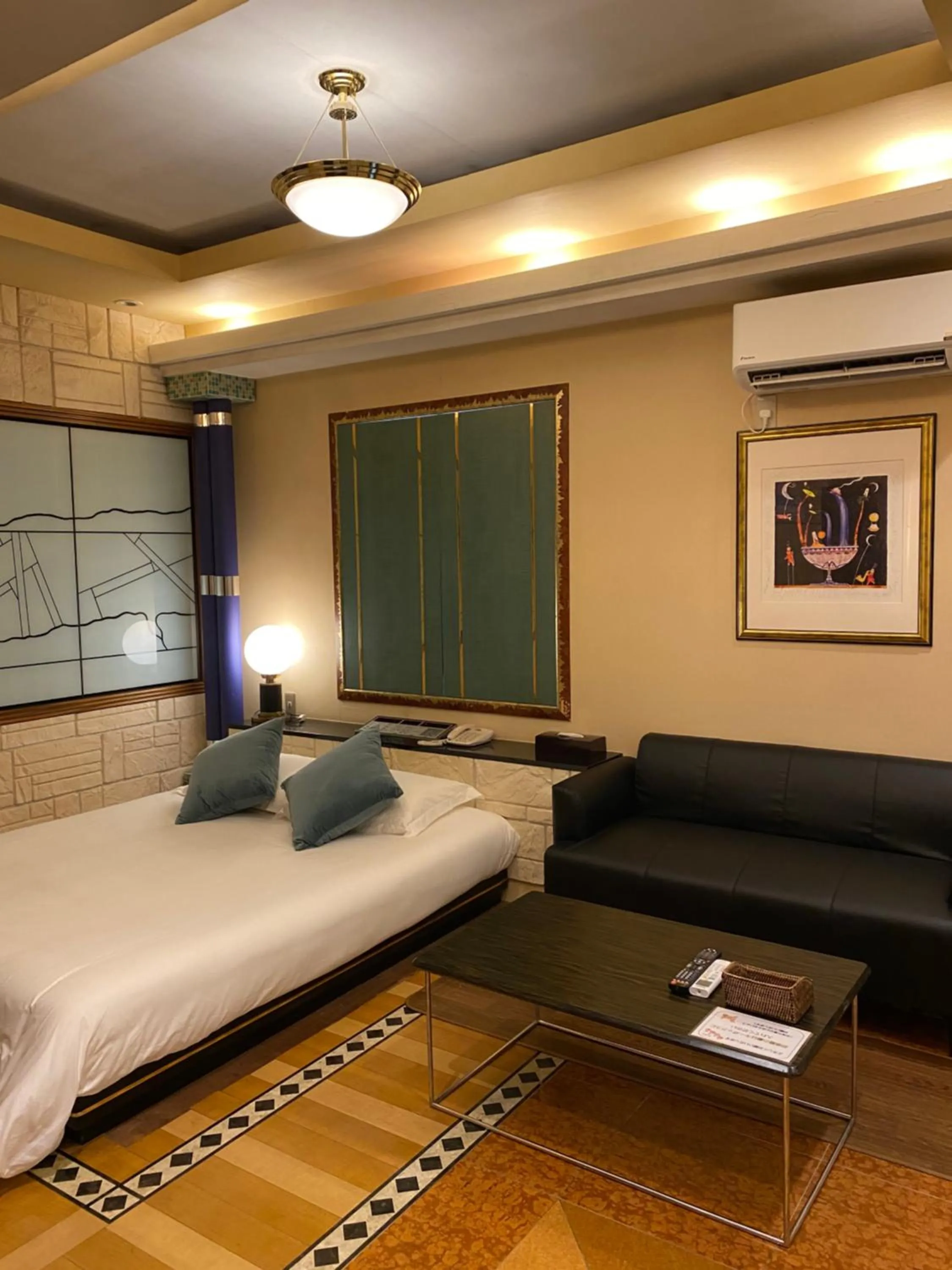 Bed in Hotel Takao Asile