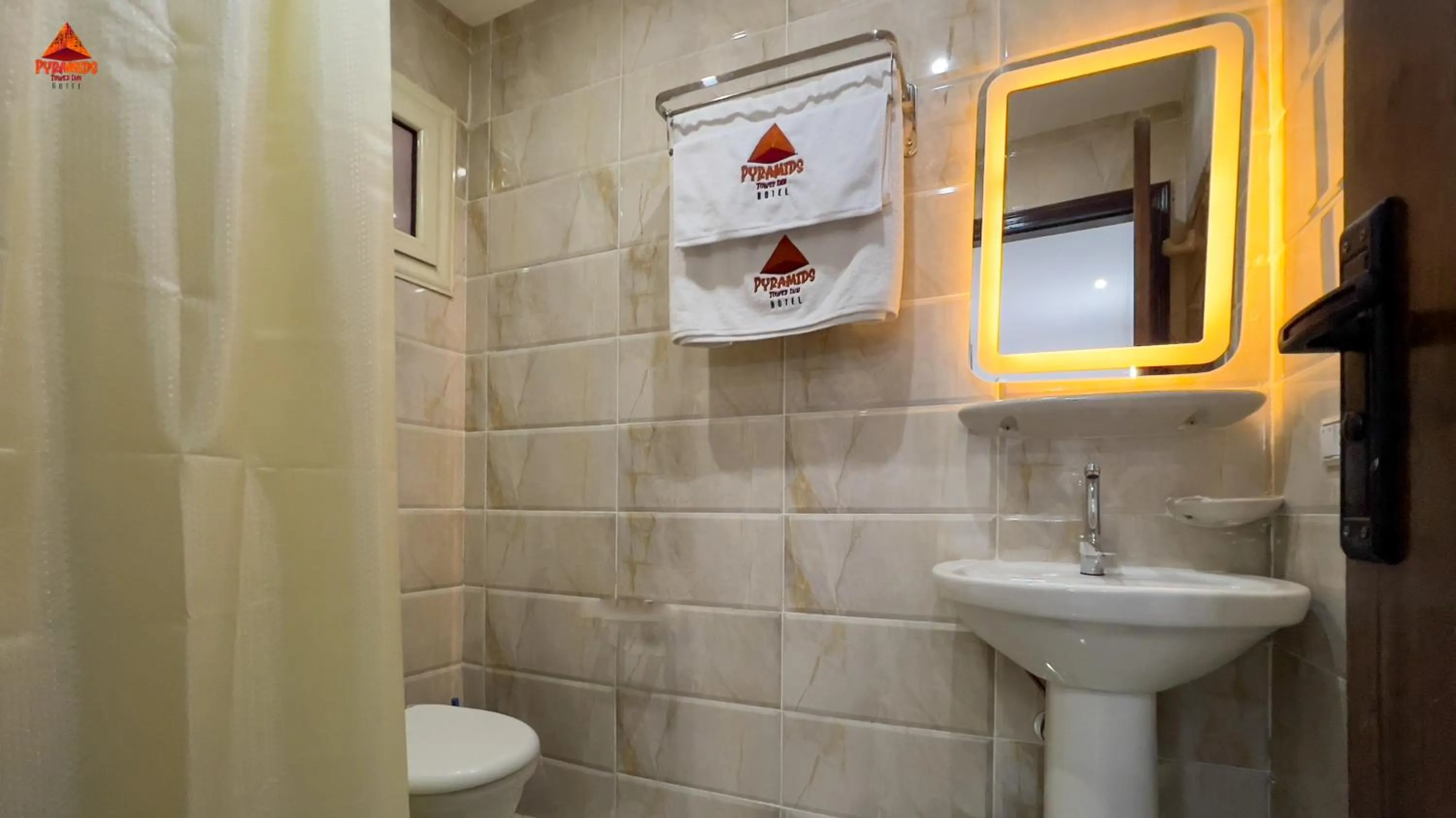 Shower in pyramids tower view inn