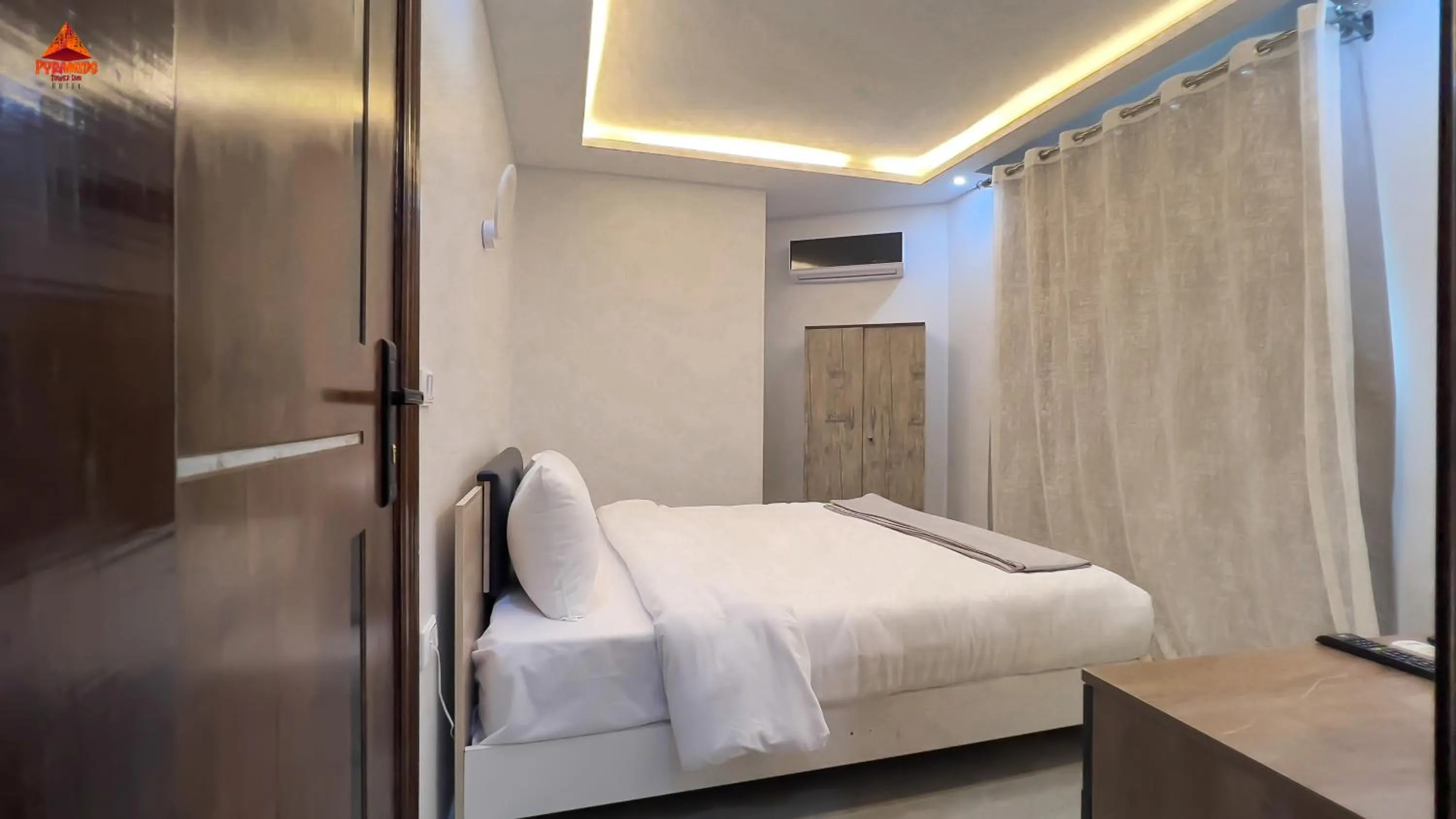 Bed in pyramids tower view inn