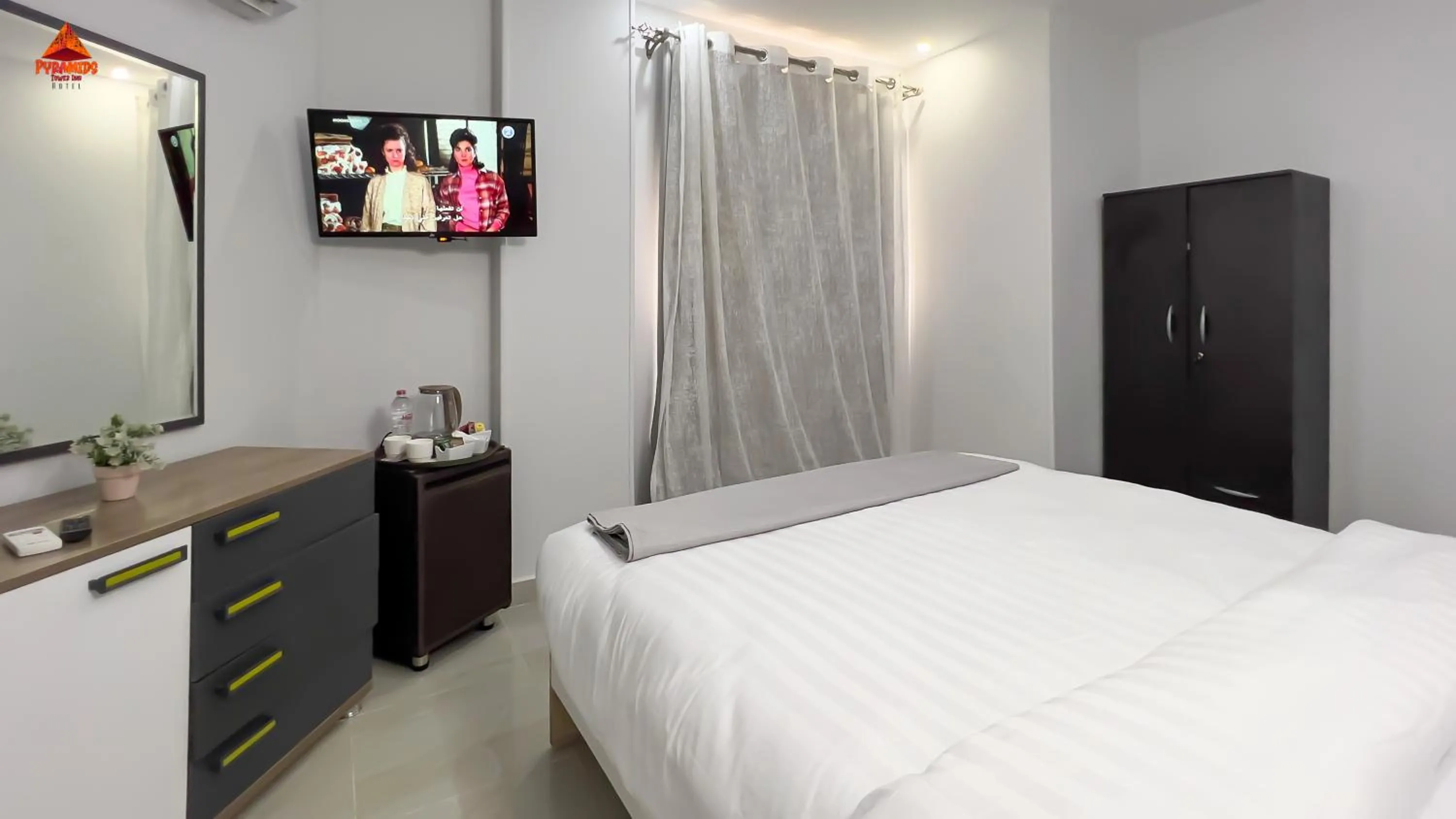 Bed in pyramids tower view inn