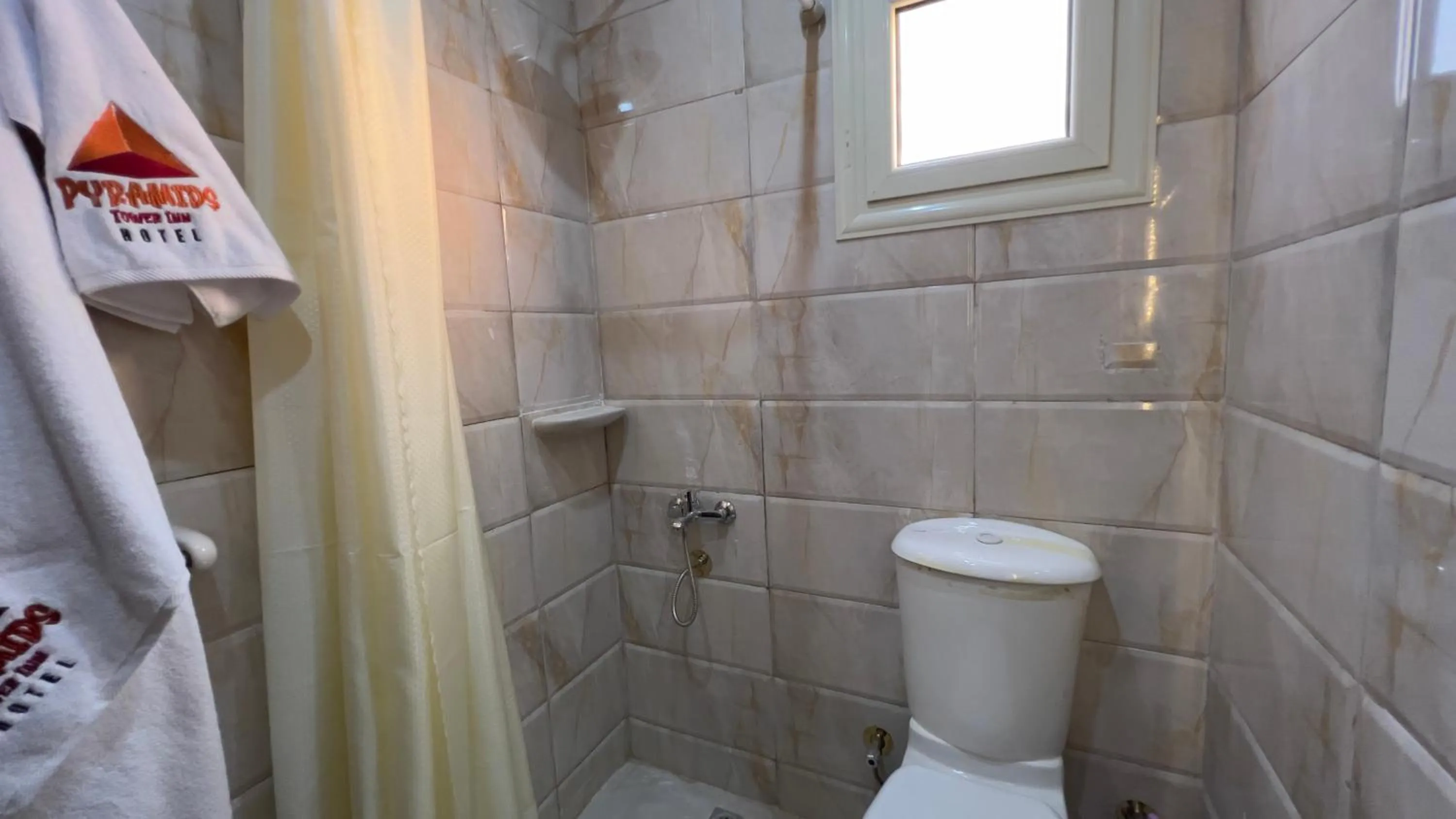 Shower in pyramids tower view inn