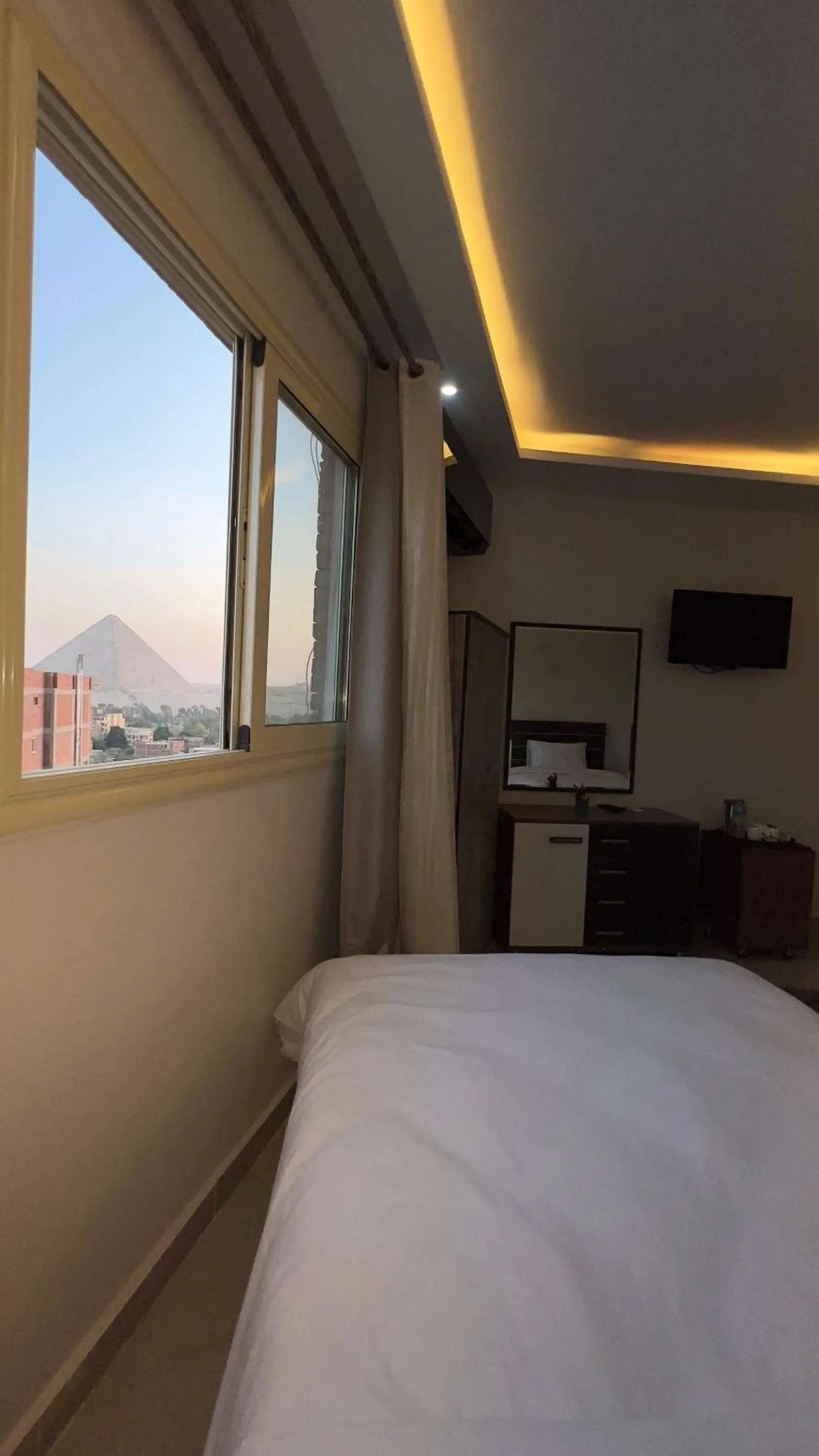 Bed in pyramids tower view inn