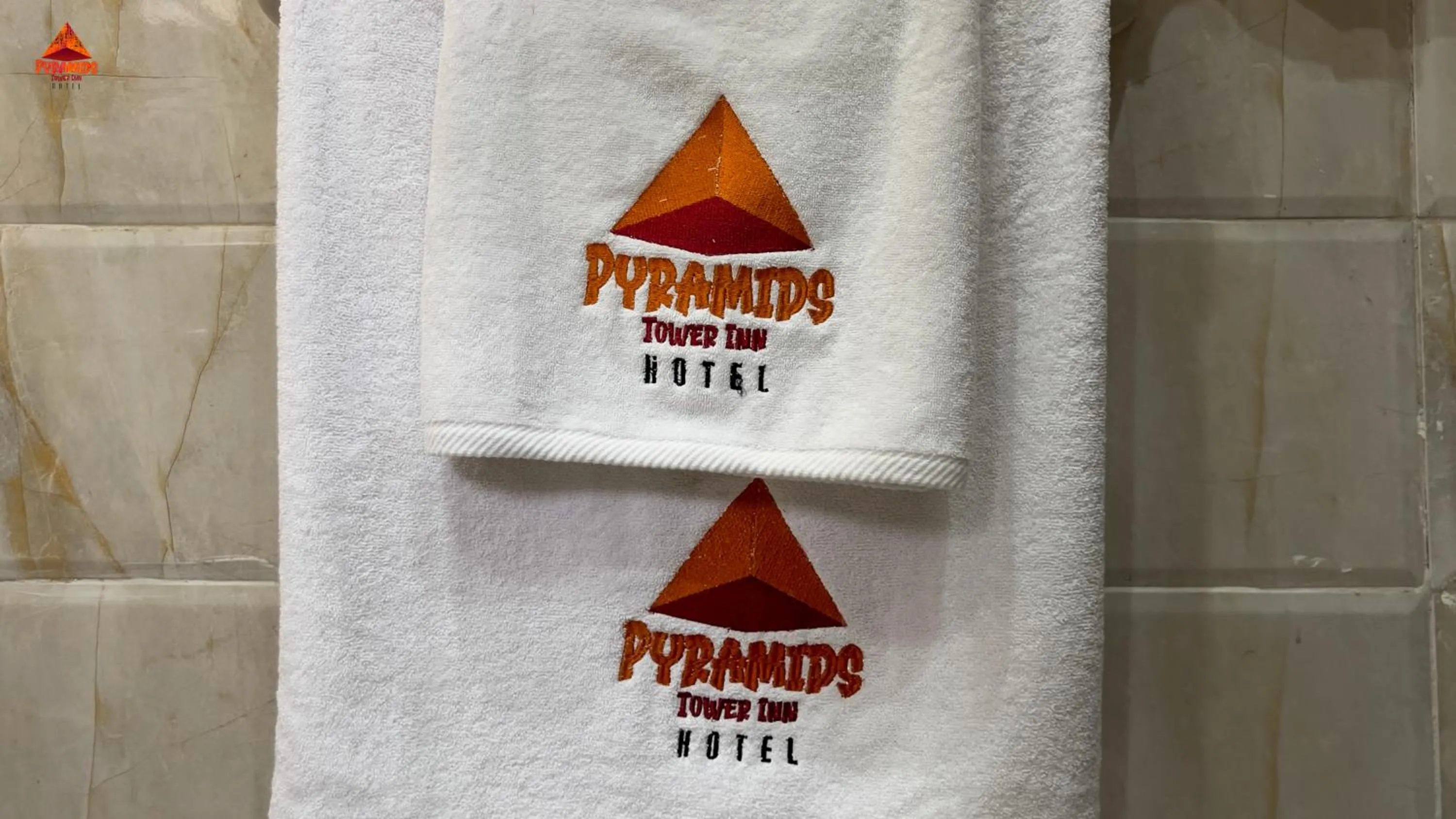 Property logo or sign in pyramids tower view inn