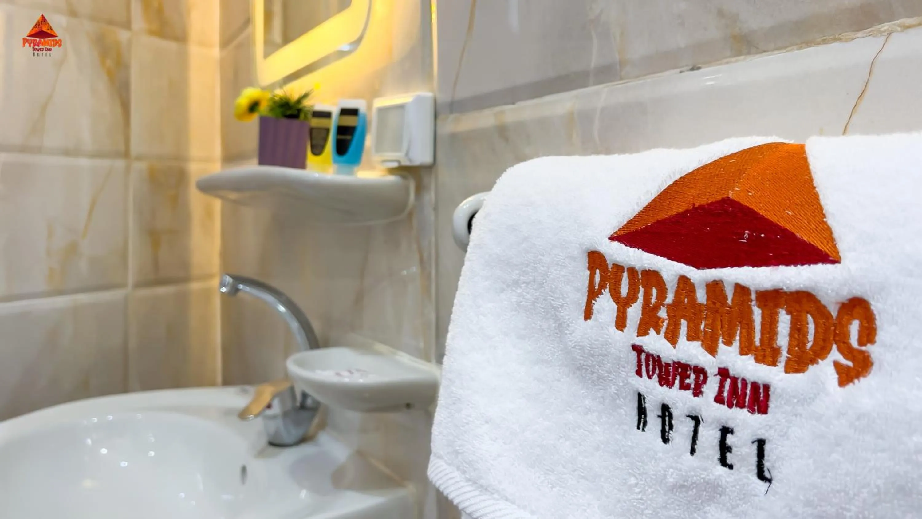 Bathroom in pyramids tower view inn