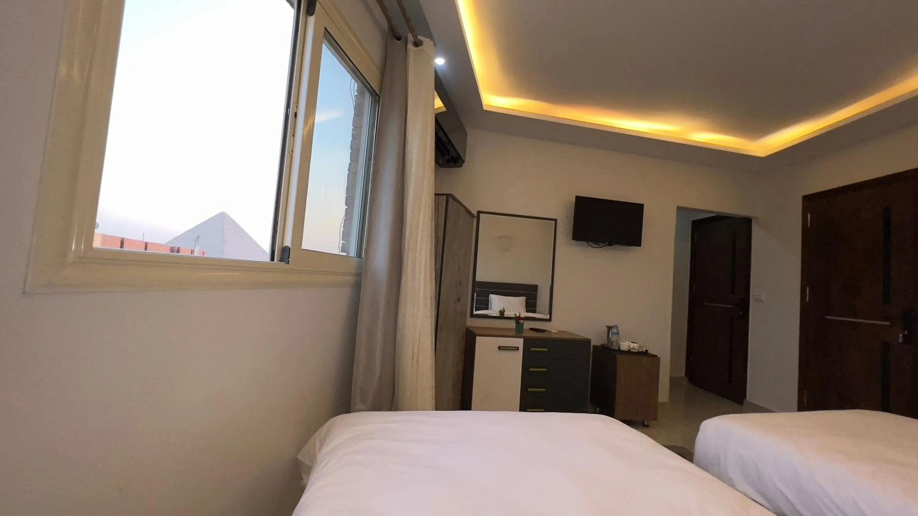 Bed in pyramids tower view inn