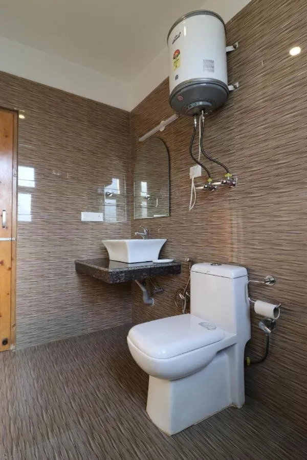 Bathroom in Hotel Neha Regency