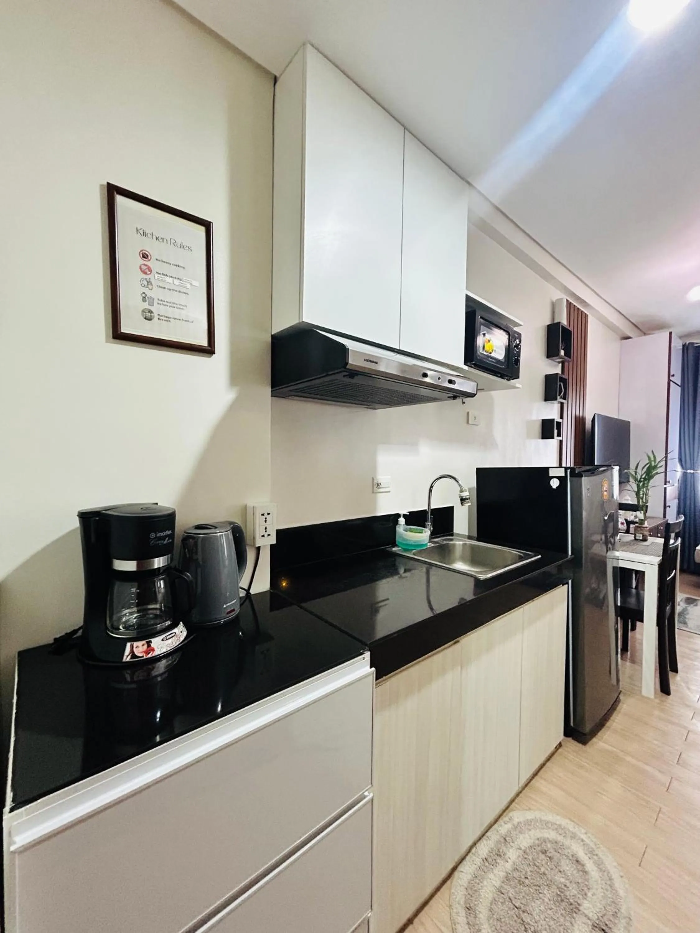 Kitchen or kitchenette in Cozy Belle Suite Relaxing Place at SMDC Hope Residences