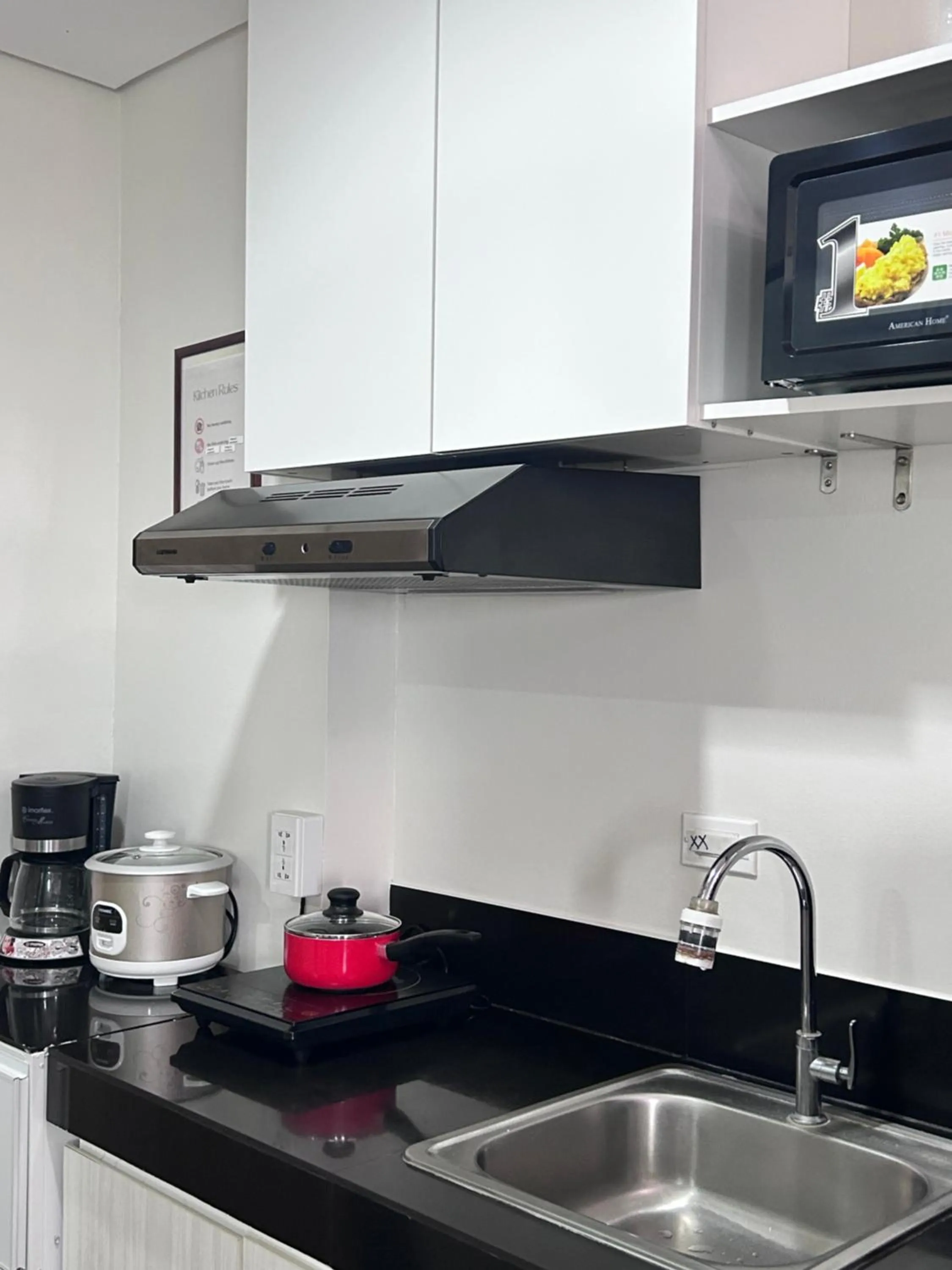 Kitchen or kitchenette in Cozy Belle Suite Relaxing Place at SMDC Hope Residences