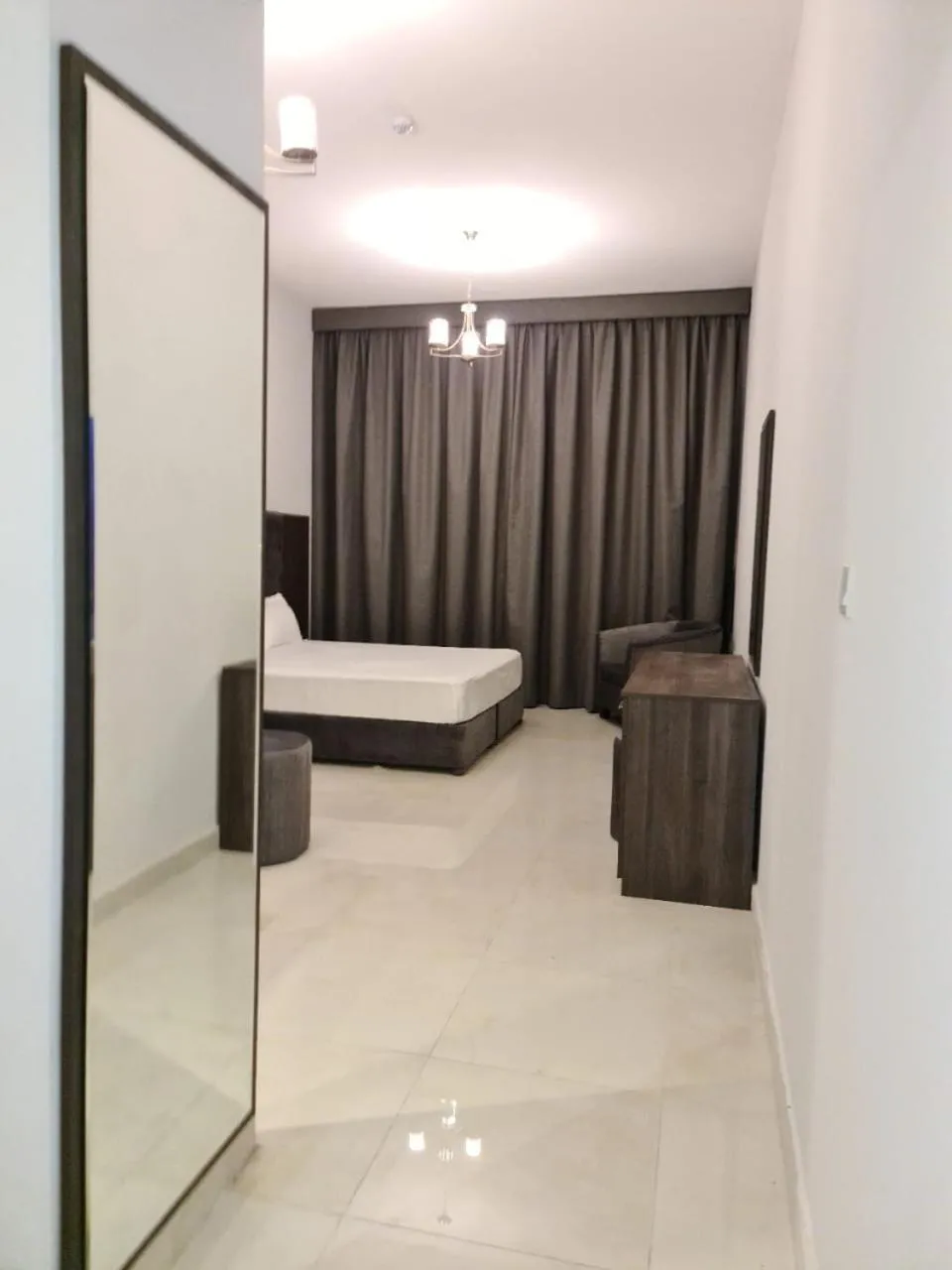 Bed in New Dream Plaza Hotel Apartment