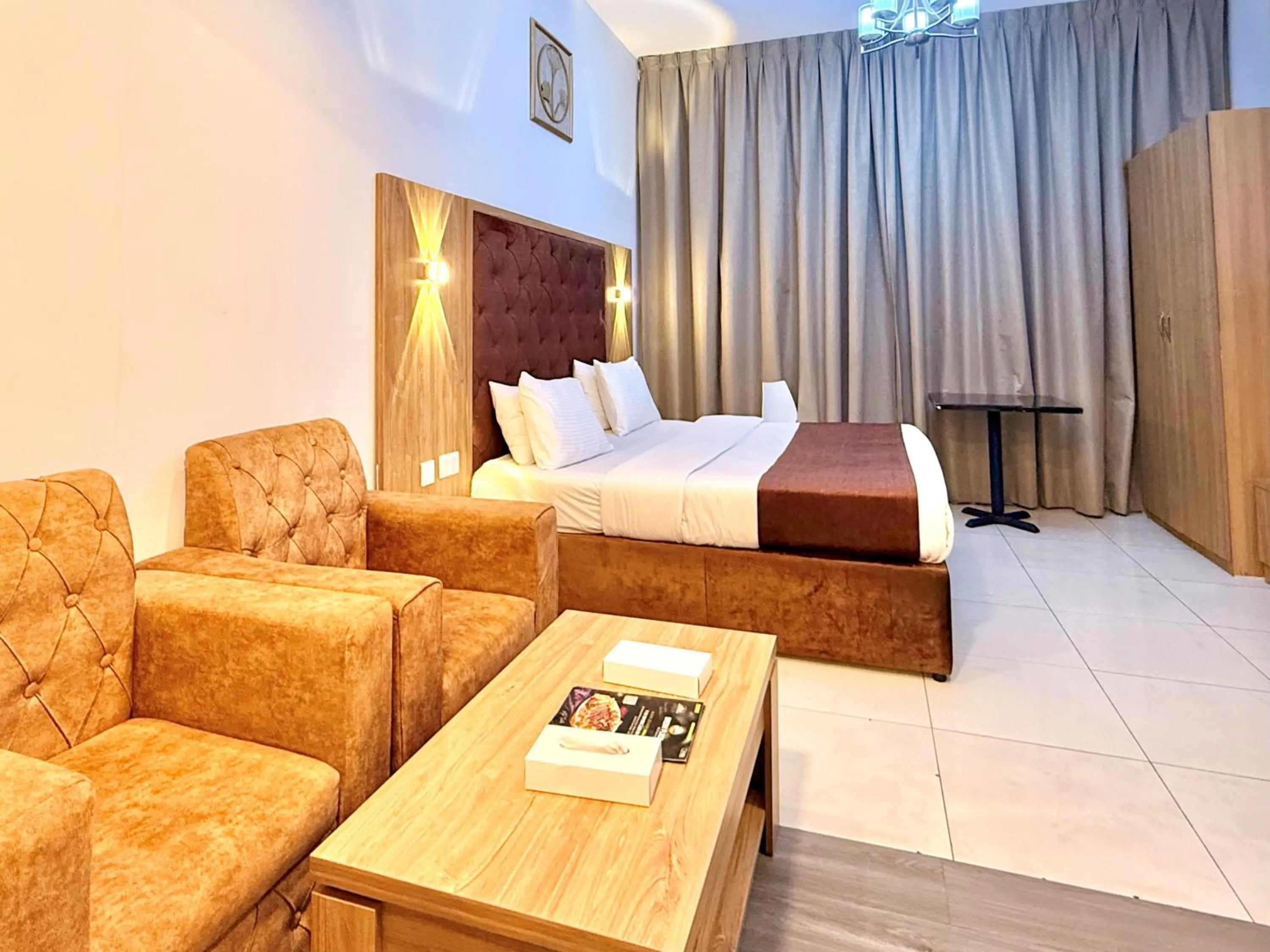 Seating area, Bed in New Dream Plaza Hotel Apartment