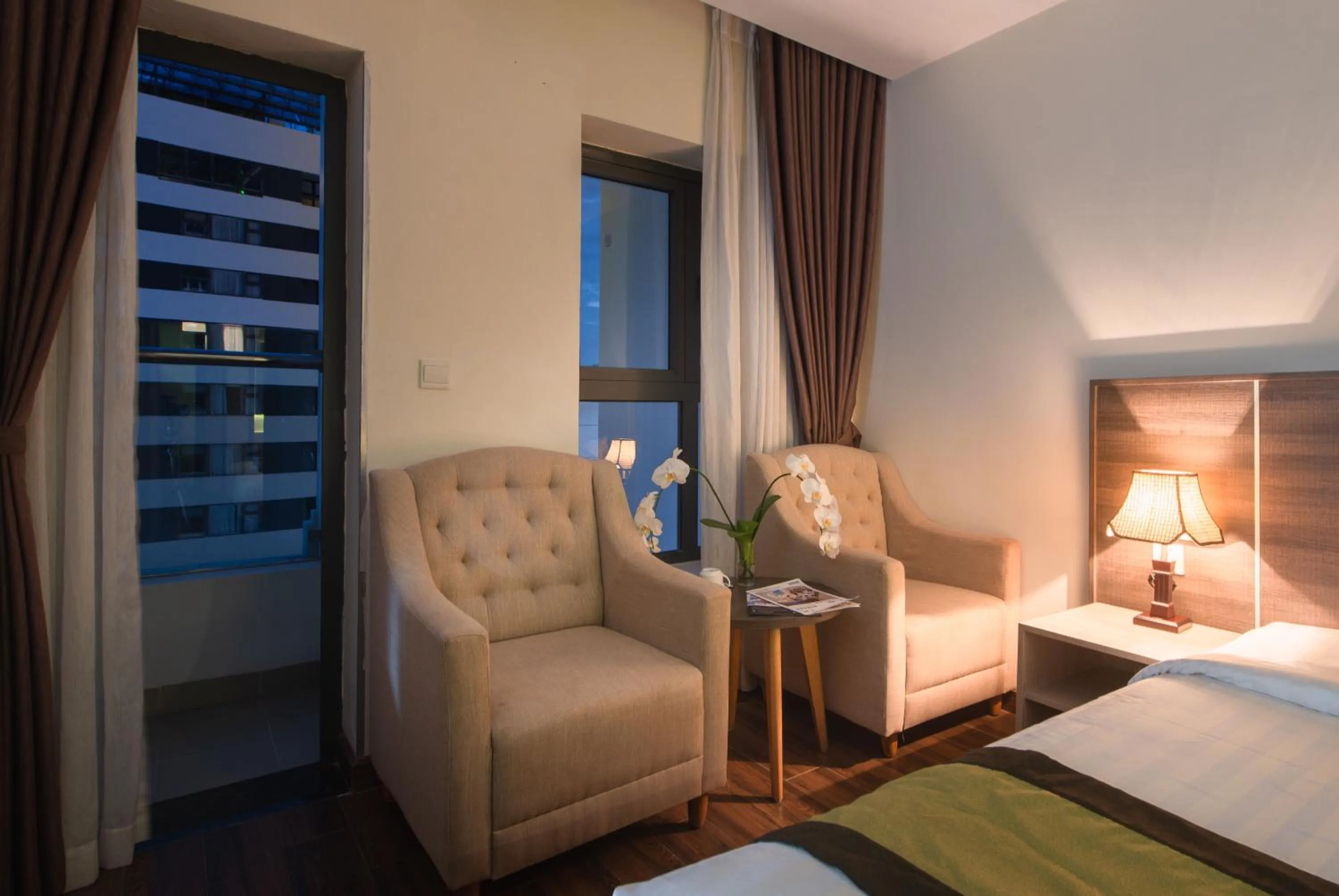 Seating area, Bed in BN Boutique Nha Trang Beach