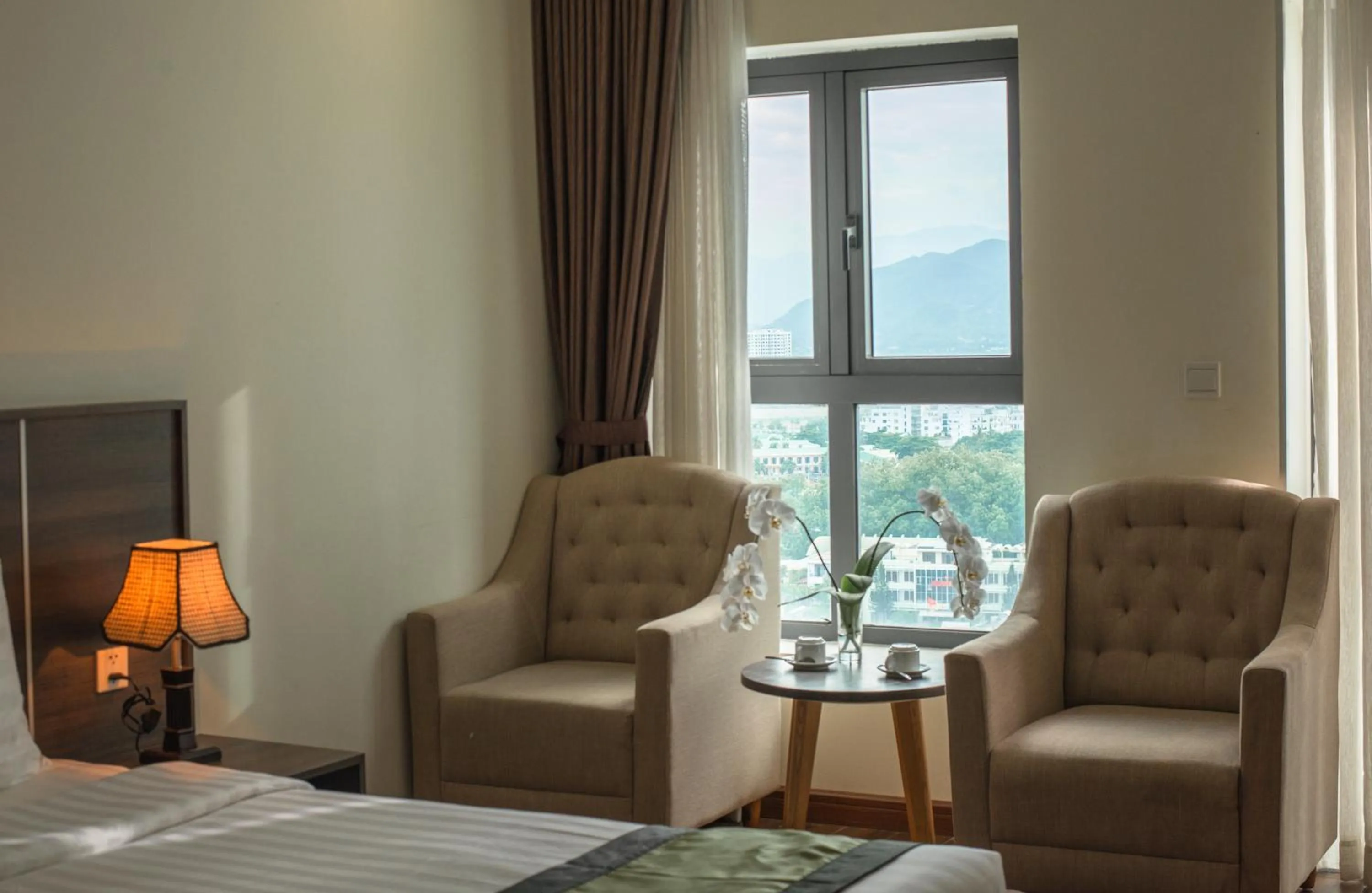 Seating area, Bed in BN Boutique Nha Trang Beach