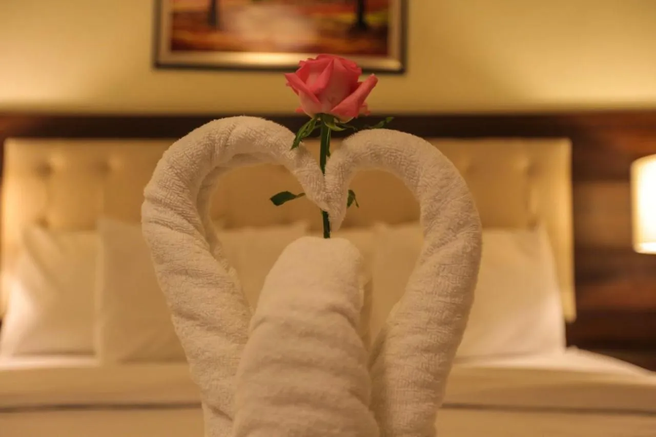 Bed in LANCASTER HOTEL APARTMENTS DAHIET ALRASHEED