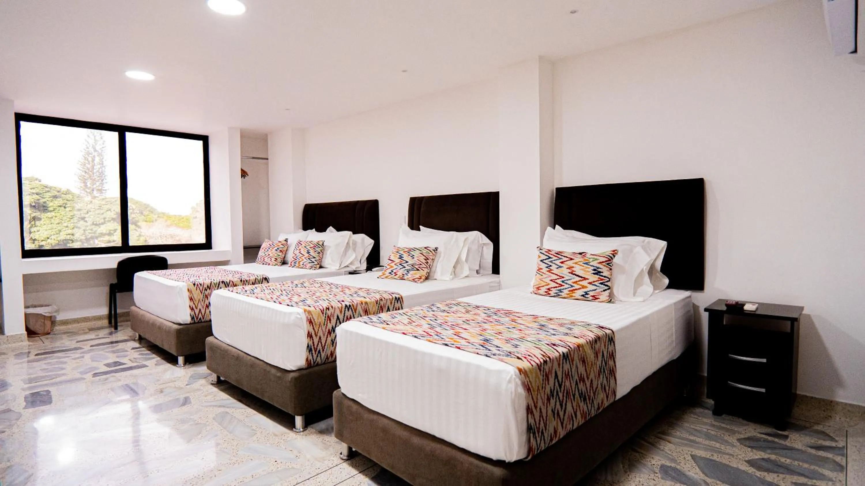 Bed in Hotel Arisha Cali