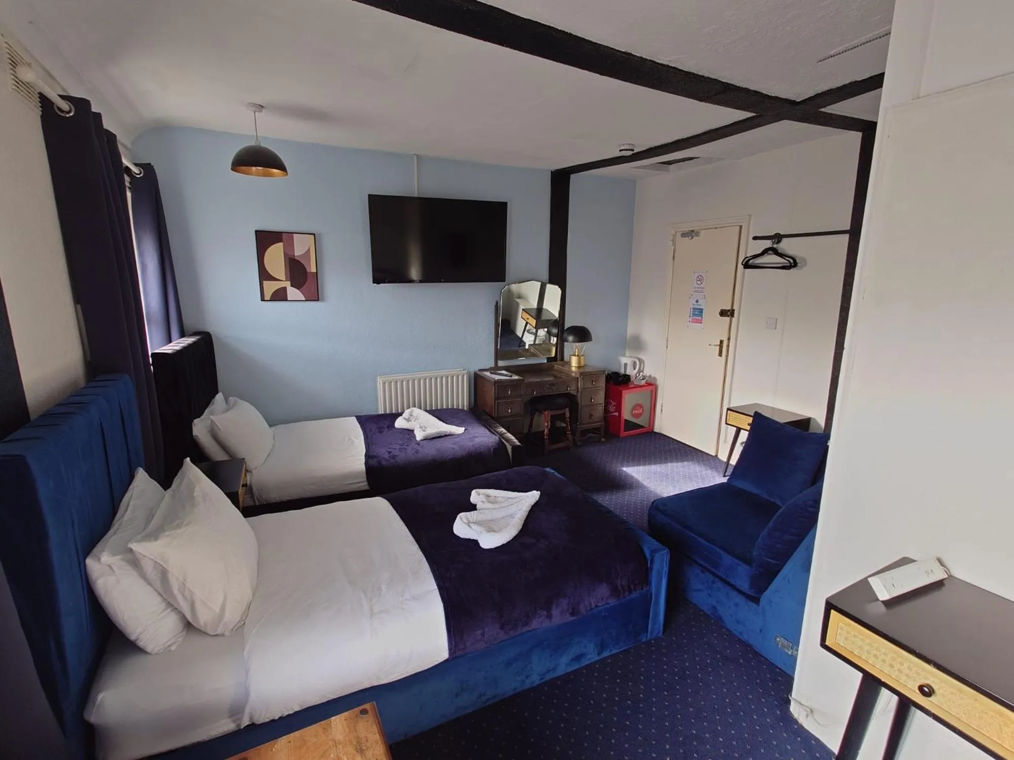 Bed in Harriette's Guest House