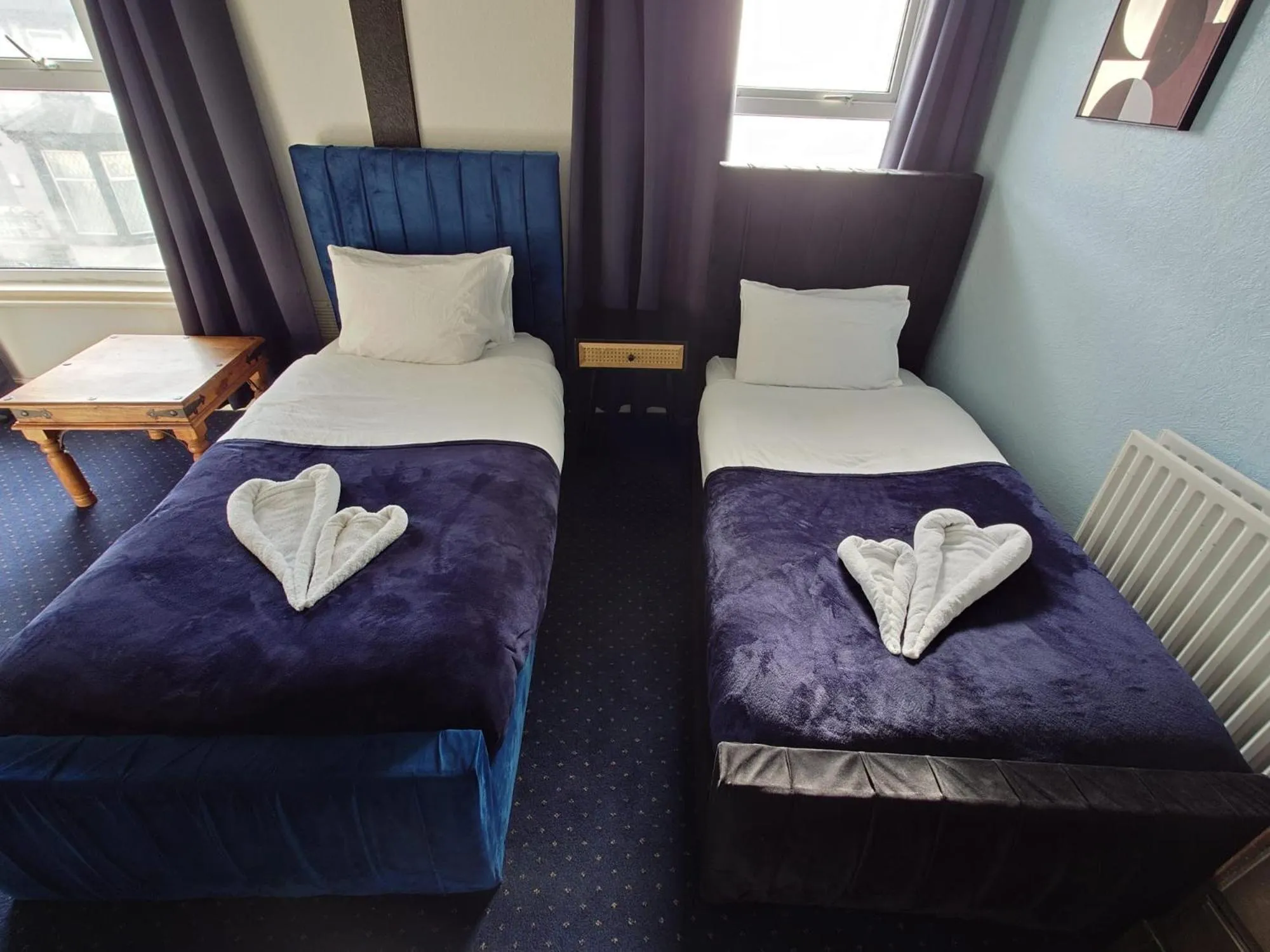 Bed in Harriette's Guest House