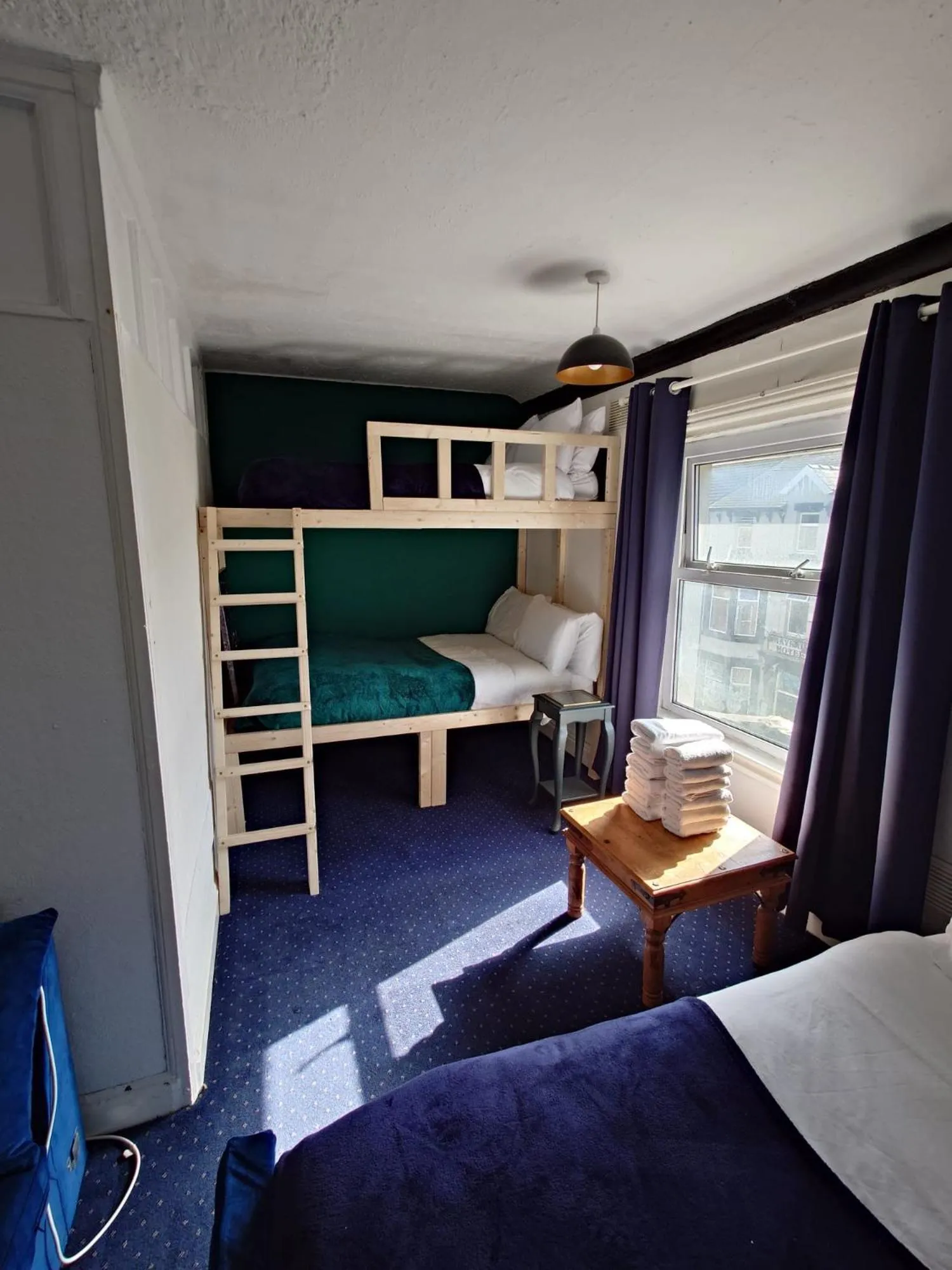 Bed in Harriette's Guest House