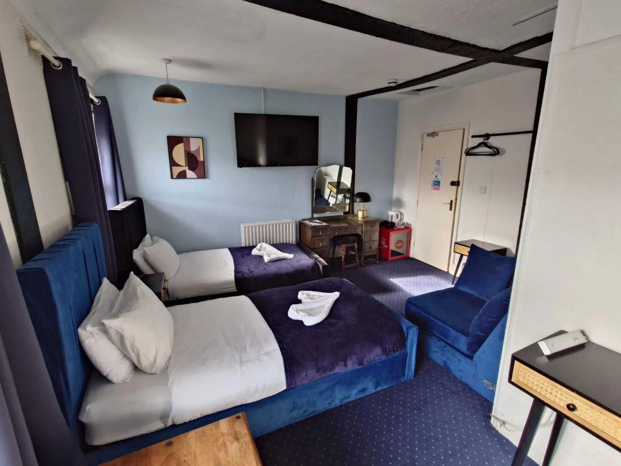 Bed in Harriette's Guest House