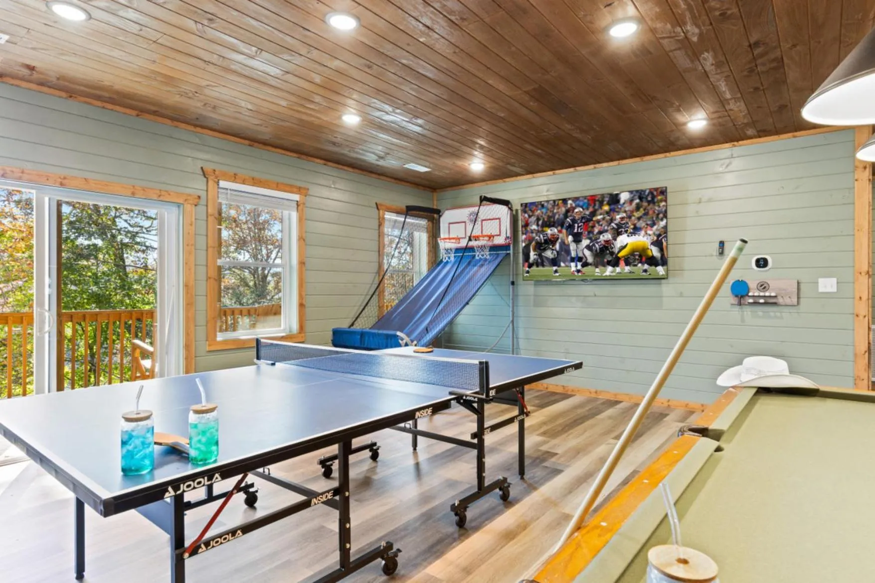 Game Room in Luxe Mountain Pool Escape by Ghosal Luxury Lodging