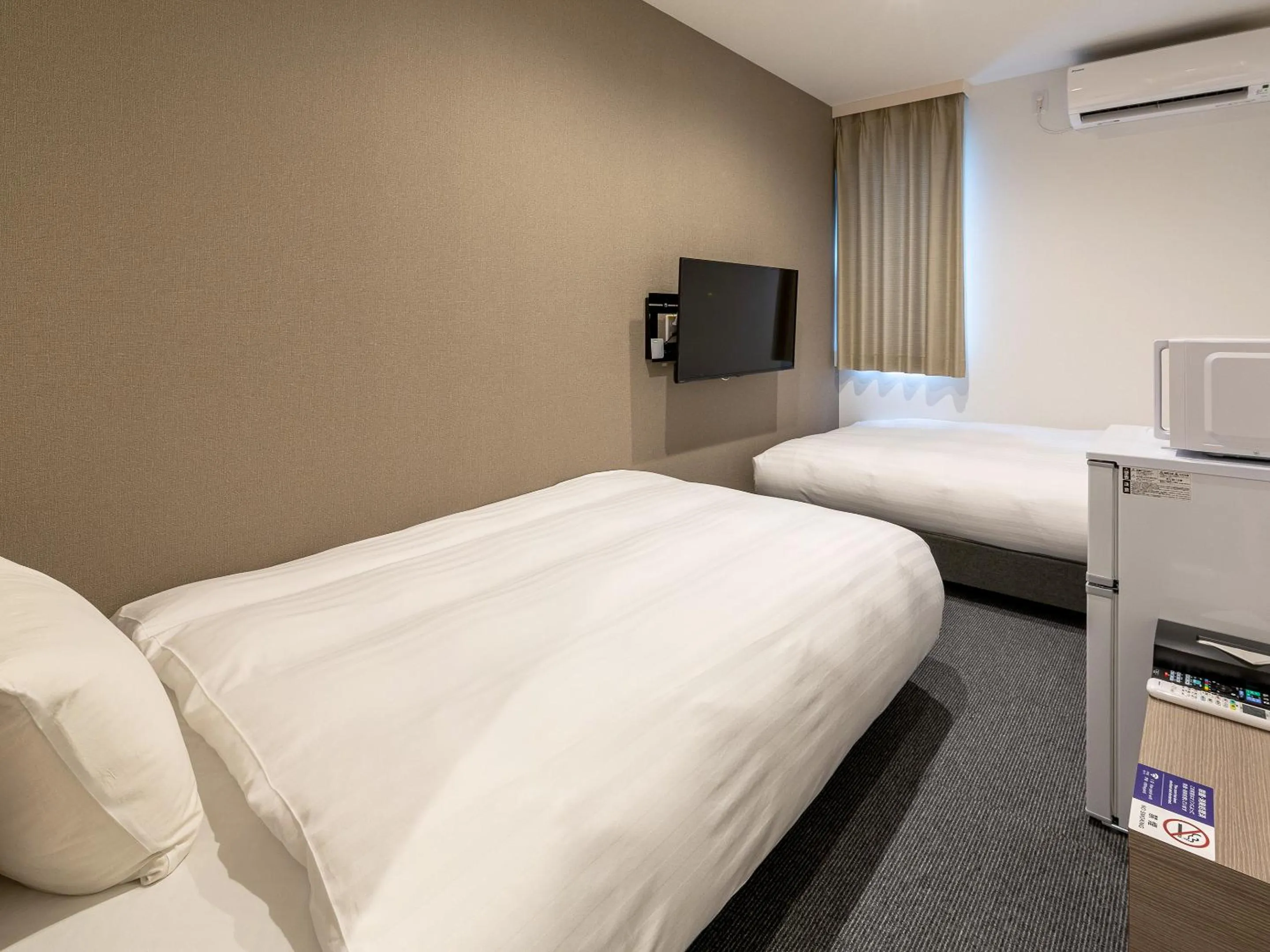 Photo of the whole room, Bed in HOTEL R9 The Yard Kanoya