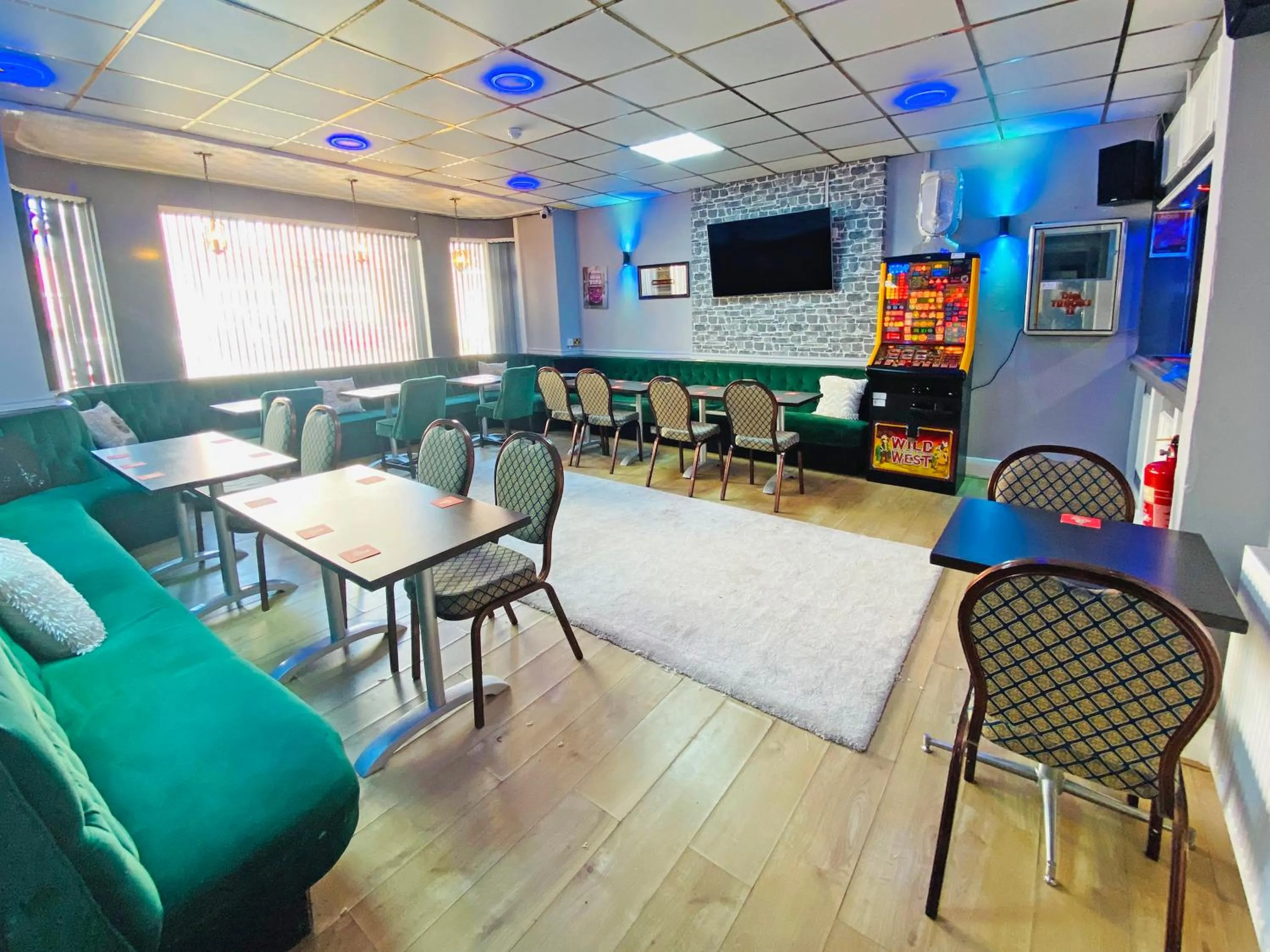 Communal lounge/ TV room in The J & S Hotel