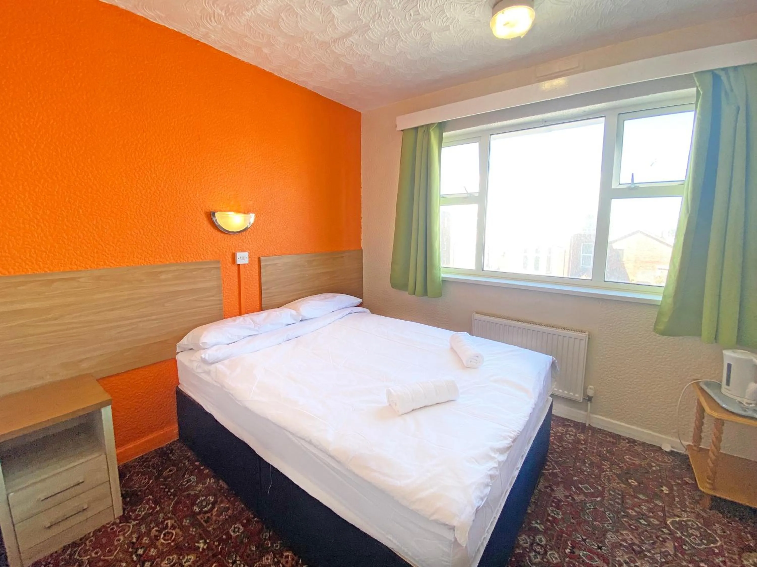 Bedroom in The J & S Hotel