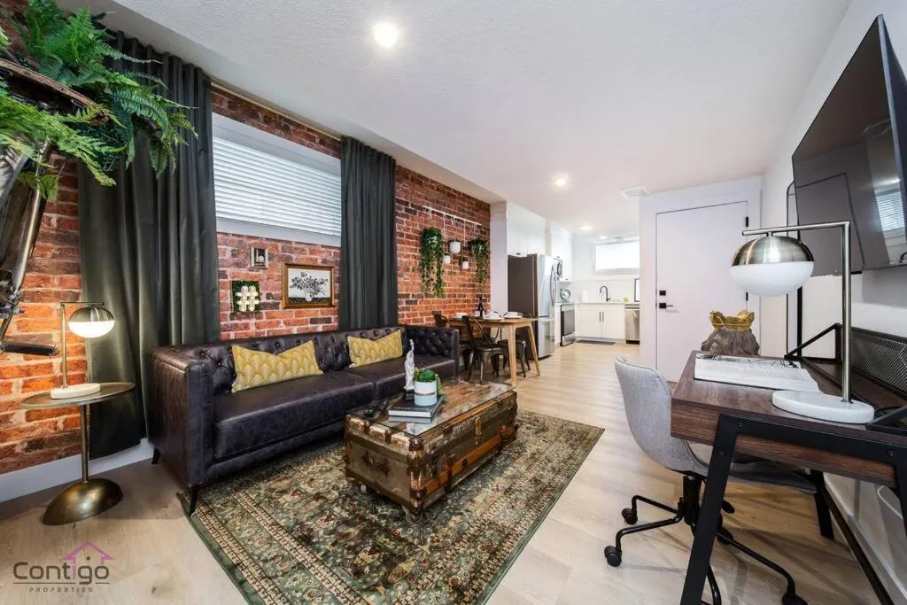 Communal lounge/ TV room in Luxe New York Style Bsmt Suite, Near DT & WEM, King Bed, WiFi