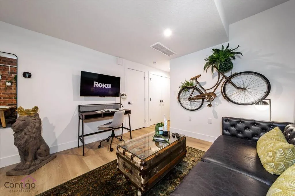 Communal lounge/ TV room in Luxe New York Style Bsmt Suite, Near DT & WEM, King Bed, WiFi