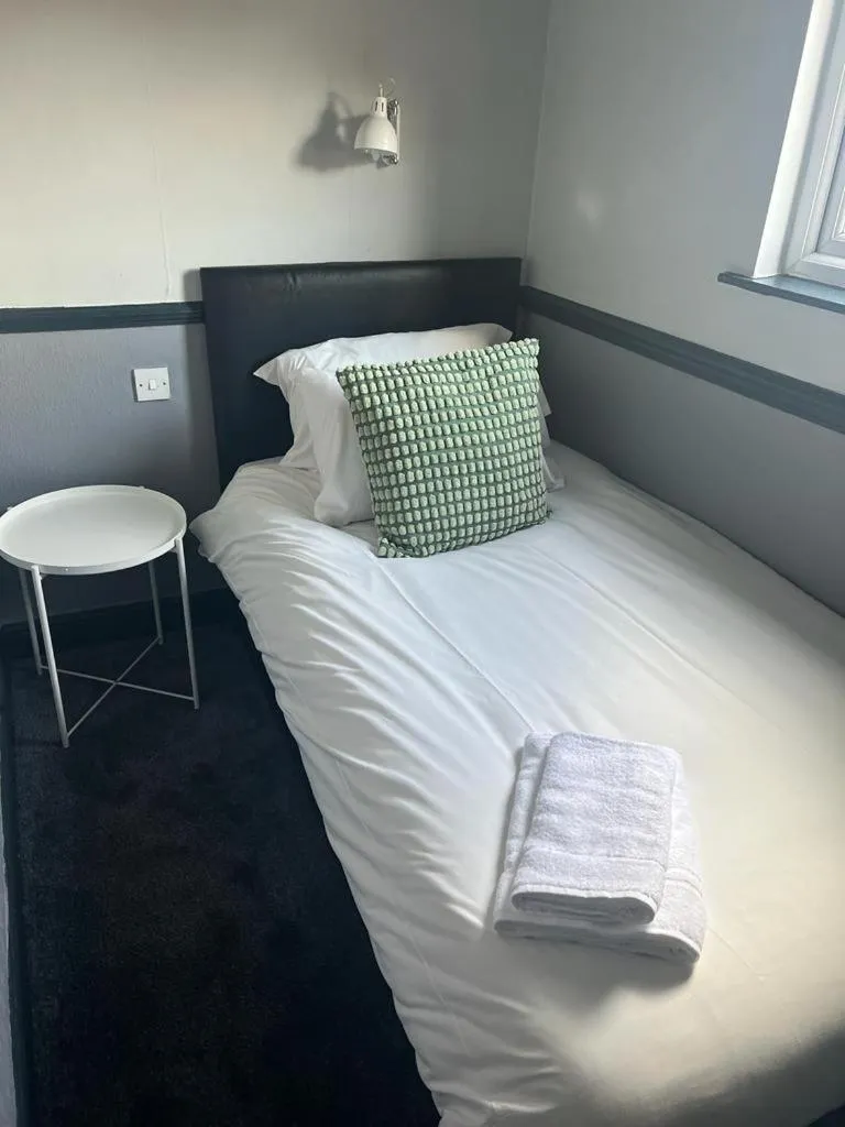 Bedroom in The Charles Dickens Hotel