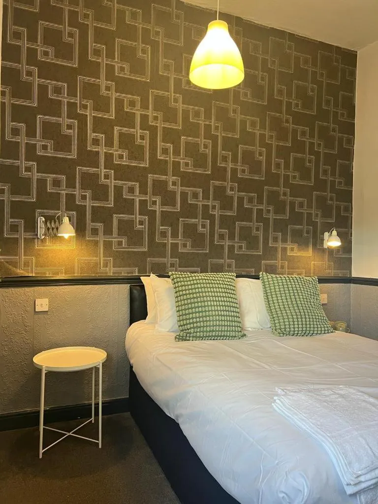 Bed in The Charles Dickens Hotel