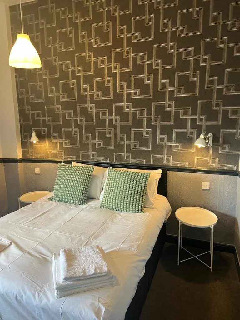 Bedroom in The Charles Dickens Hotel