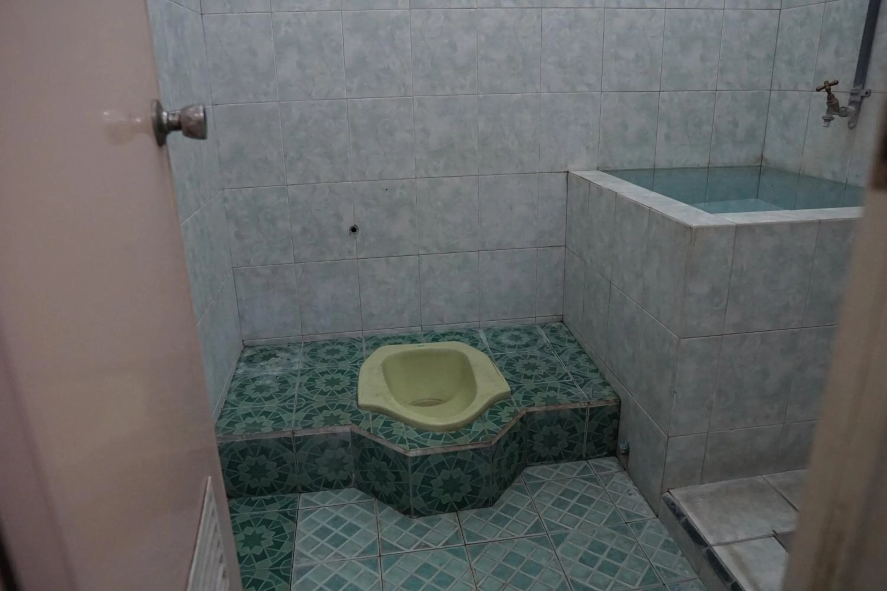 Bathroom in Hotel O Yoko Kost Syariah