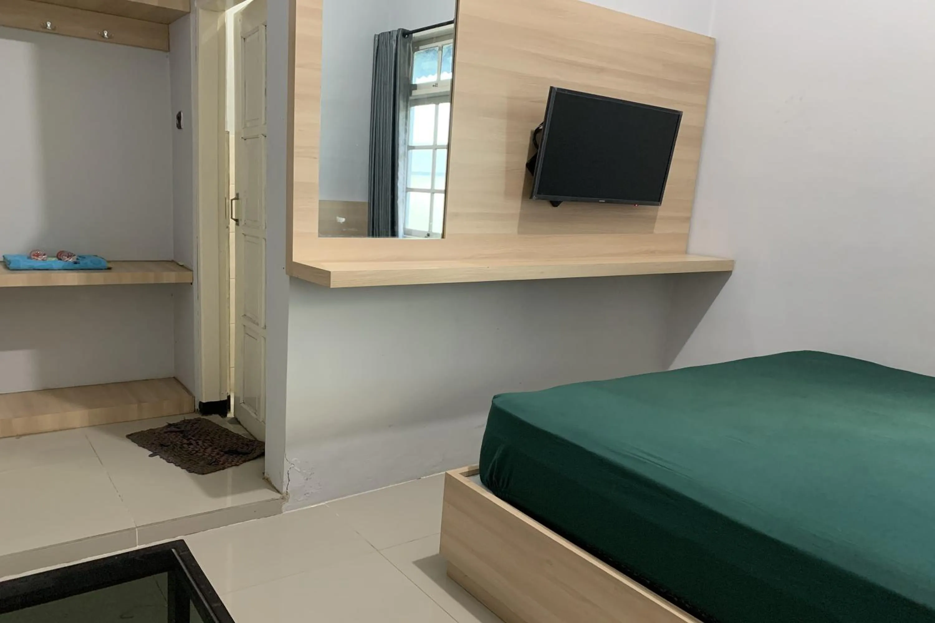 Bed in Hotel Merak Indah